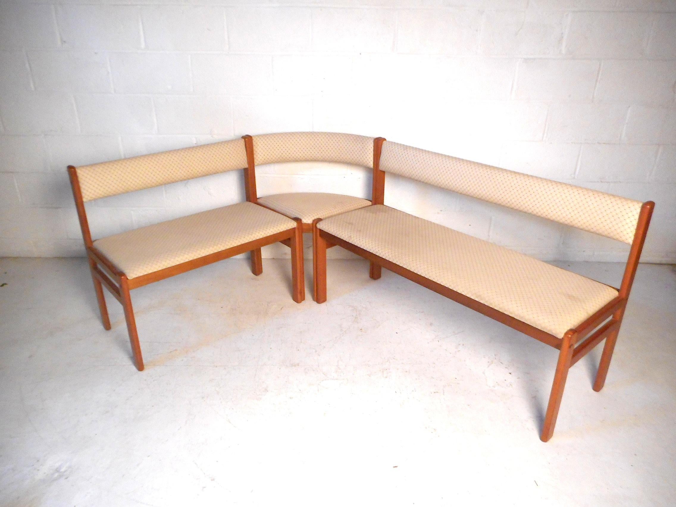 This unusual midcentury sectional bench features beautifully patterned upholstery and teak wood frames. Four pieces in all (two benches, a corner chair, and a single chair), this set can be assembled all together or placed separately, either way it