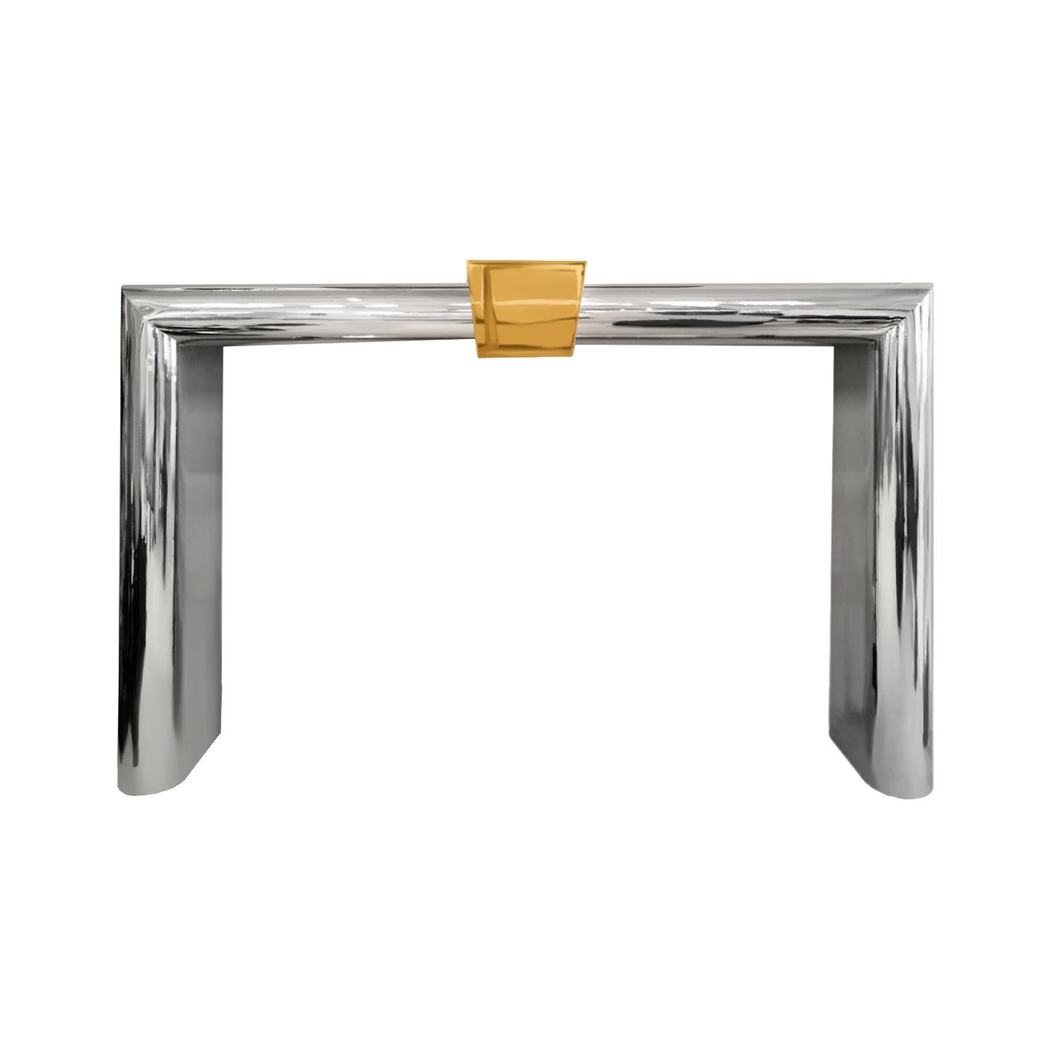 Fireplace surround in polished stainless steel with polished brass keystone by Danny Alesandro Ltd, American 1980's.  This artisan fireplace surround is beautifully made and in the style of Karl Springer.  Danny Alesandro, Ltd. was sold through