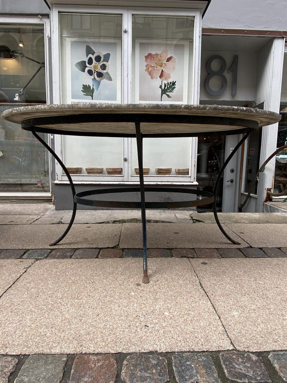 Super elegant vintage French darker hued marble table, with a beautifully curved base in midnight blue painted wrought iron. A lovely large elliptical solid marble top, easily room for 6 people to sit around.

The table has the most delicious raw