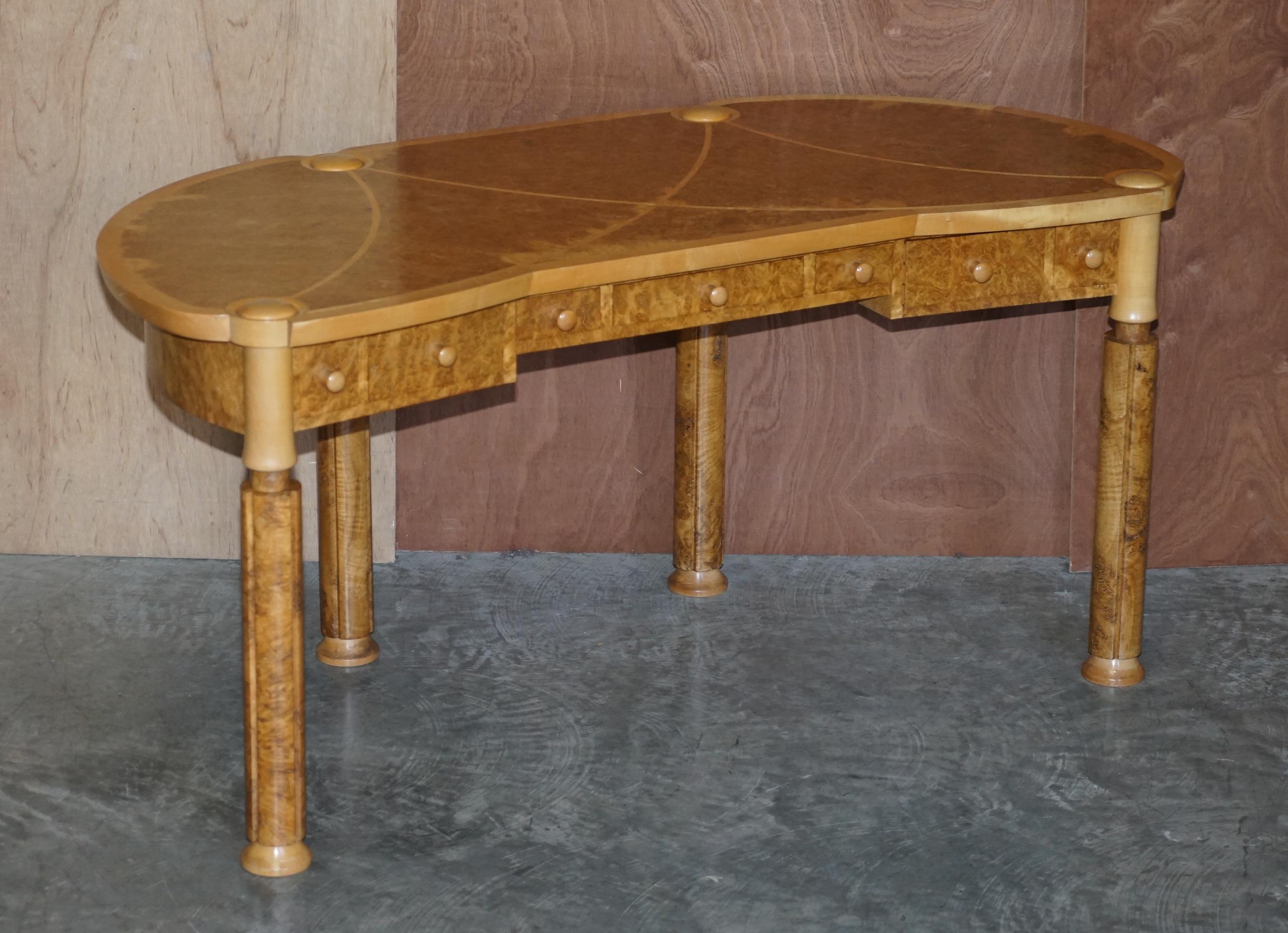 We are delighted to offer for sale this absolutely exquisite burr & burl walnut & satinwood kidney shaped writing table desk by David Linley

This piece is solid burr walnut with satinwood ascents, by solid burr I mean real solid all the way