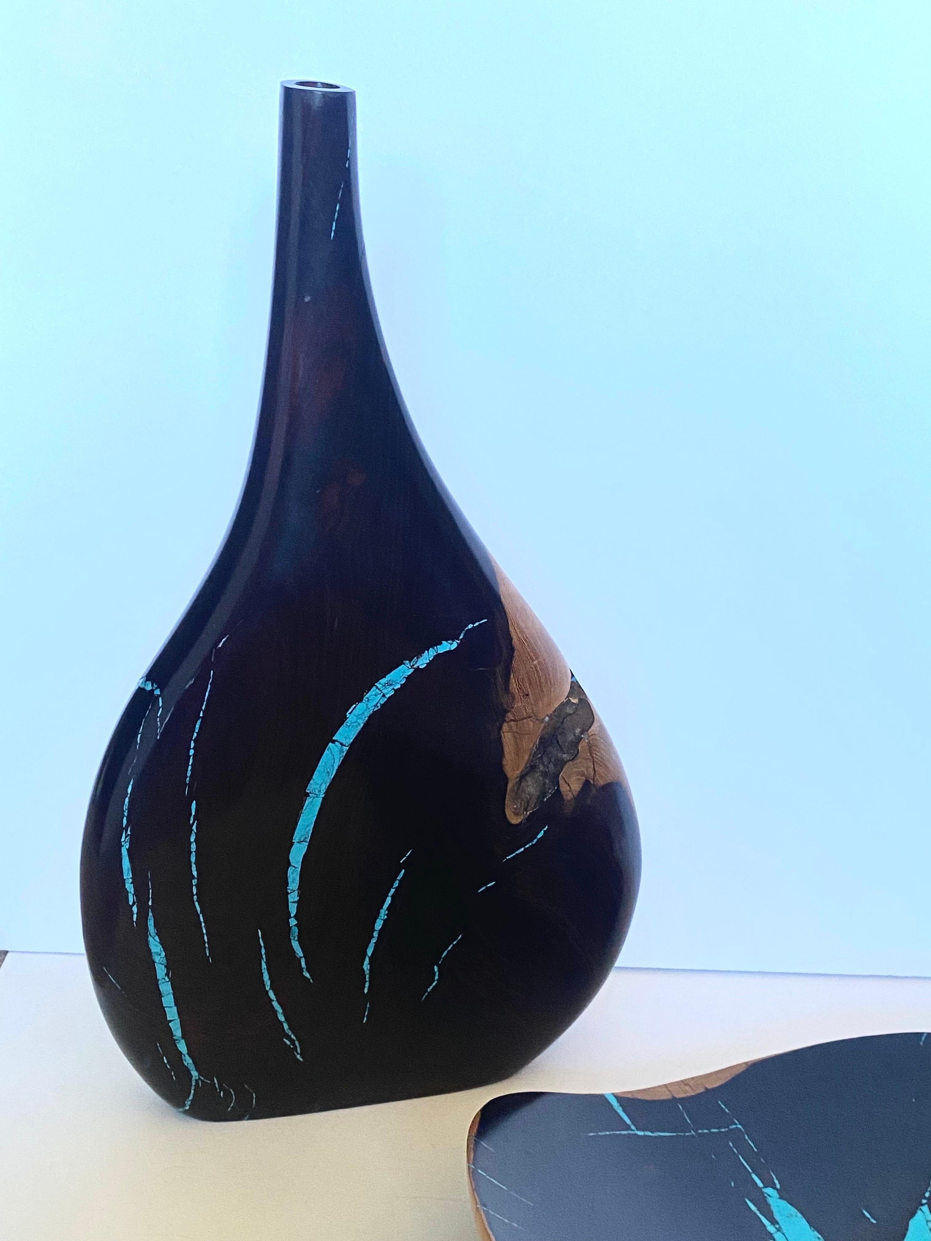 Discover the exquisite craftsmanship of Larry, an artisan celebrated for his mastery of desert ironwood. These captivating pieces, from a private collector, feature a beautifully shaped vessel and an elegant bowl, both showcasing the striking