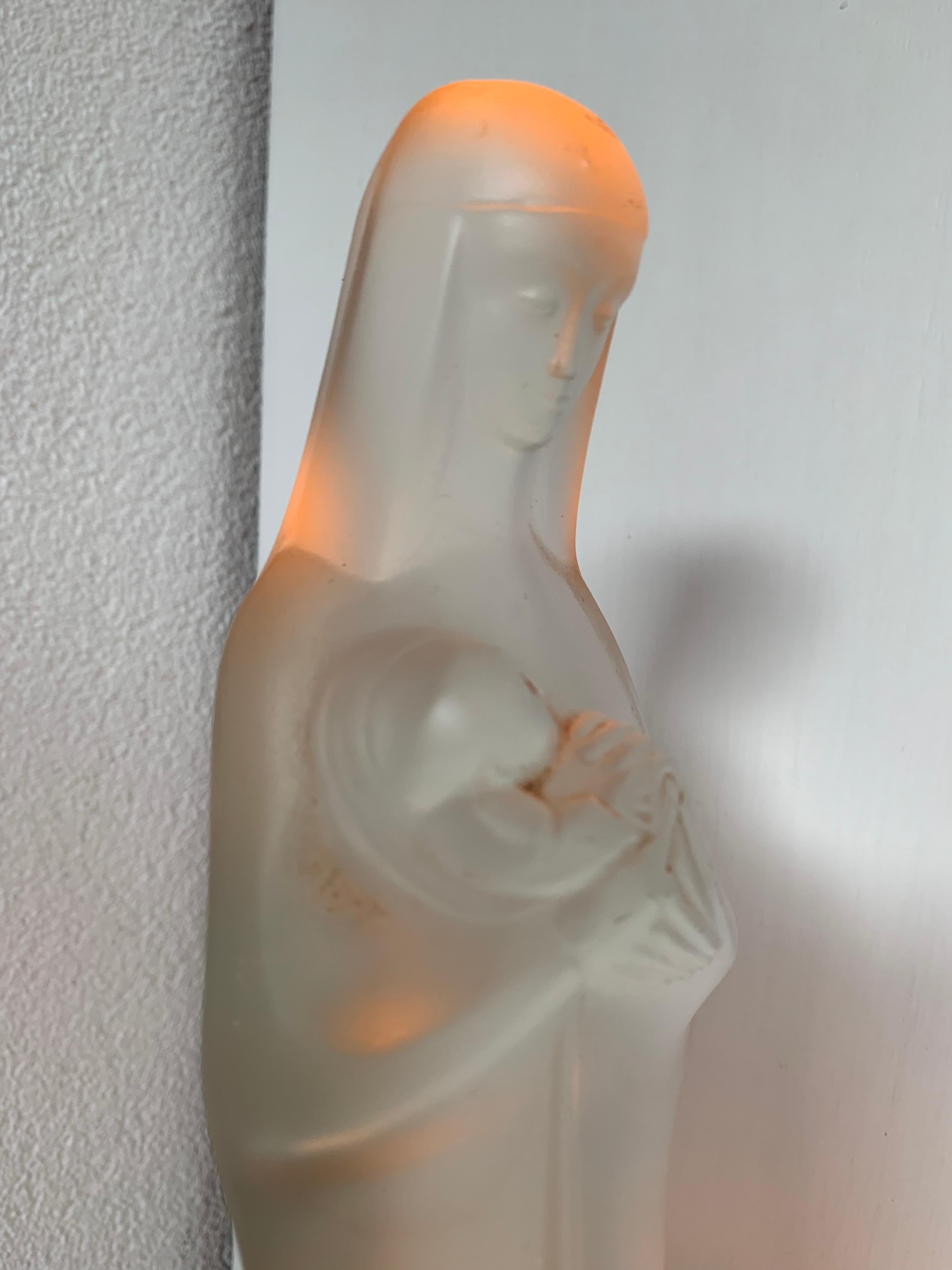 Beautiful and inspiring Mother Mary statuette by Steph Uiterwaal.

If you are a collector of stylish and meaningful religious art then this serene and divine sculpture of Mary holding her new-born child Jesus could be the perfect addition to your