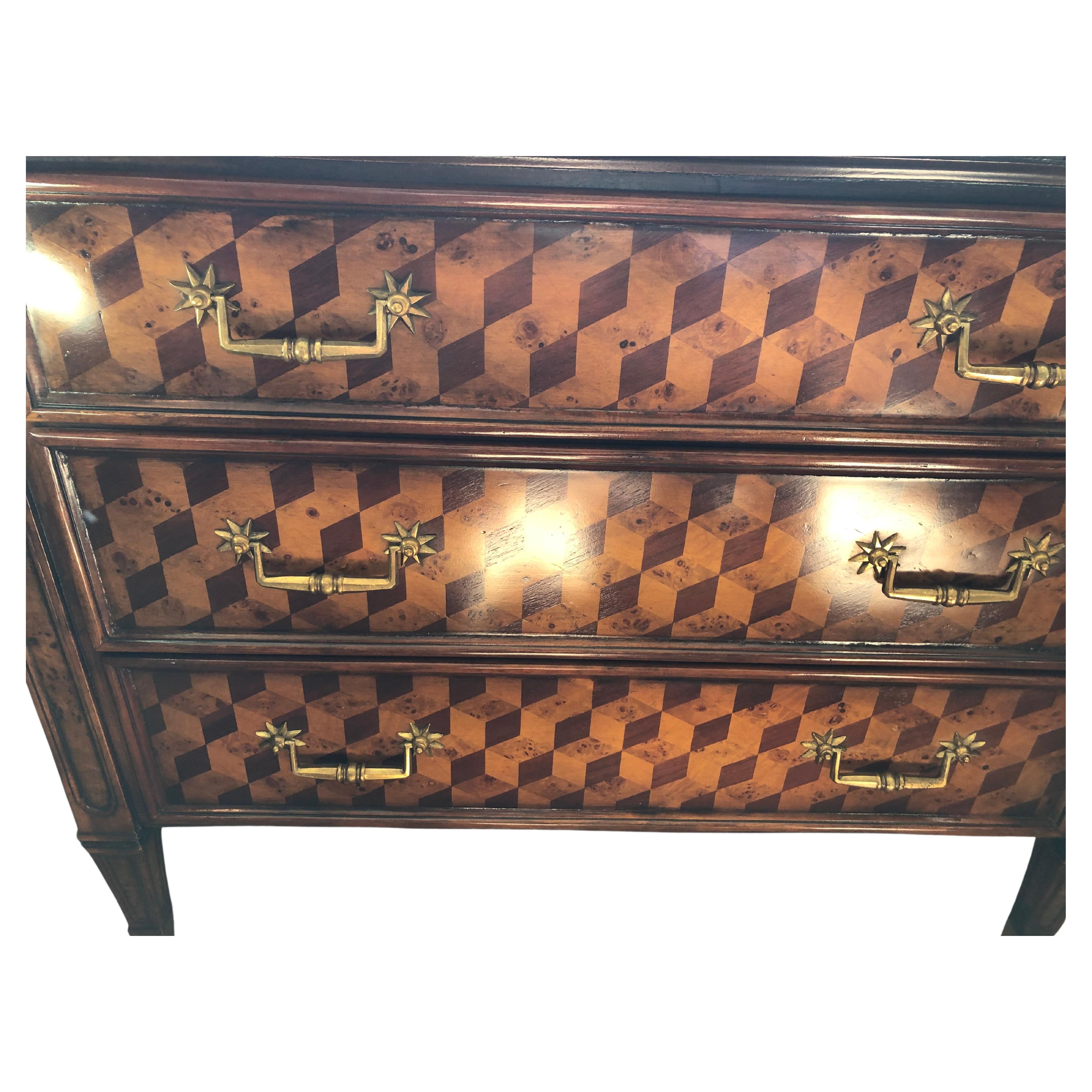 Richly inlaid and wonderfully patterned designer mixed wood chest of drawers having a lively diamond motif and handsome brass hardware.  Heavy and solid construction.  3 well functioning drawers.