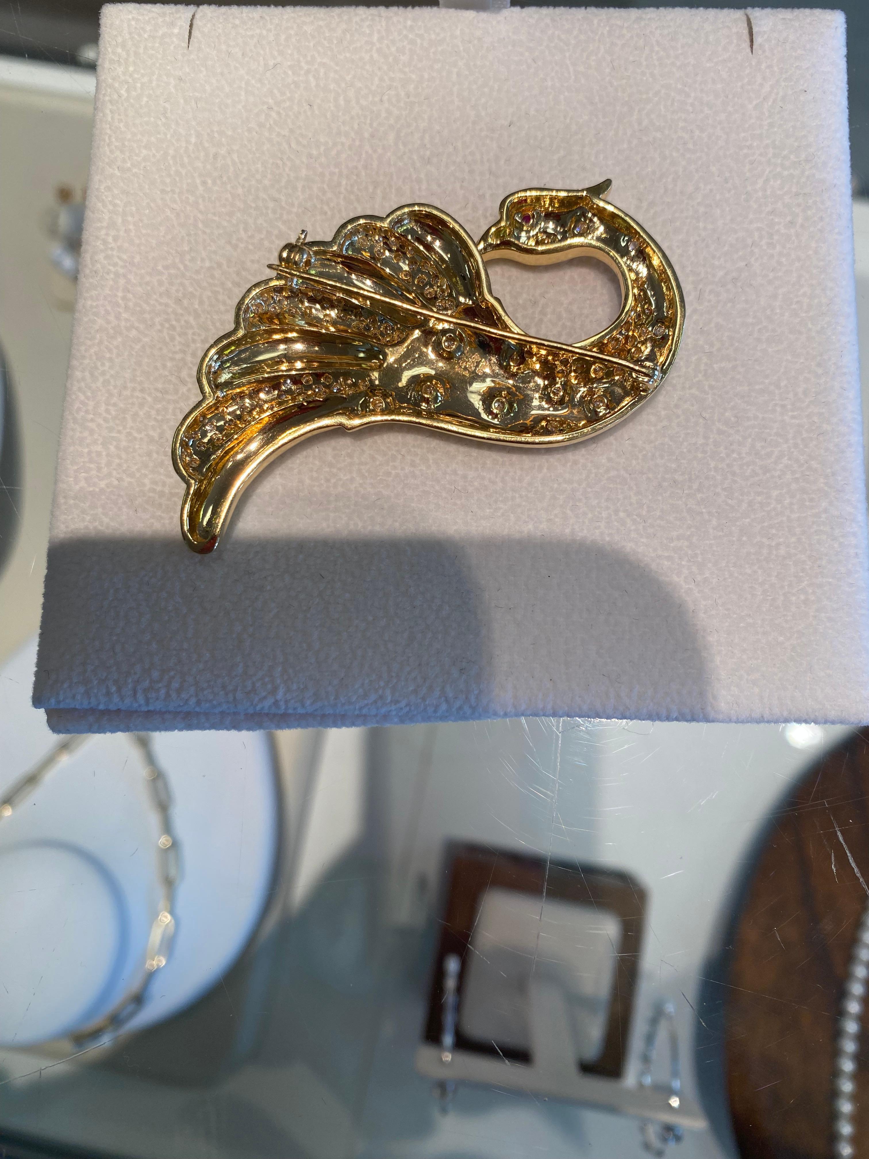 One 18kt yellow gold peacock bird pin.  This beautiful, significant pin has 104 round, brilliant diamonds set.  They are bright GH color, and weigh aproximately 1.33 cts total weight.  This pin is a great size, as to make the look of an entire