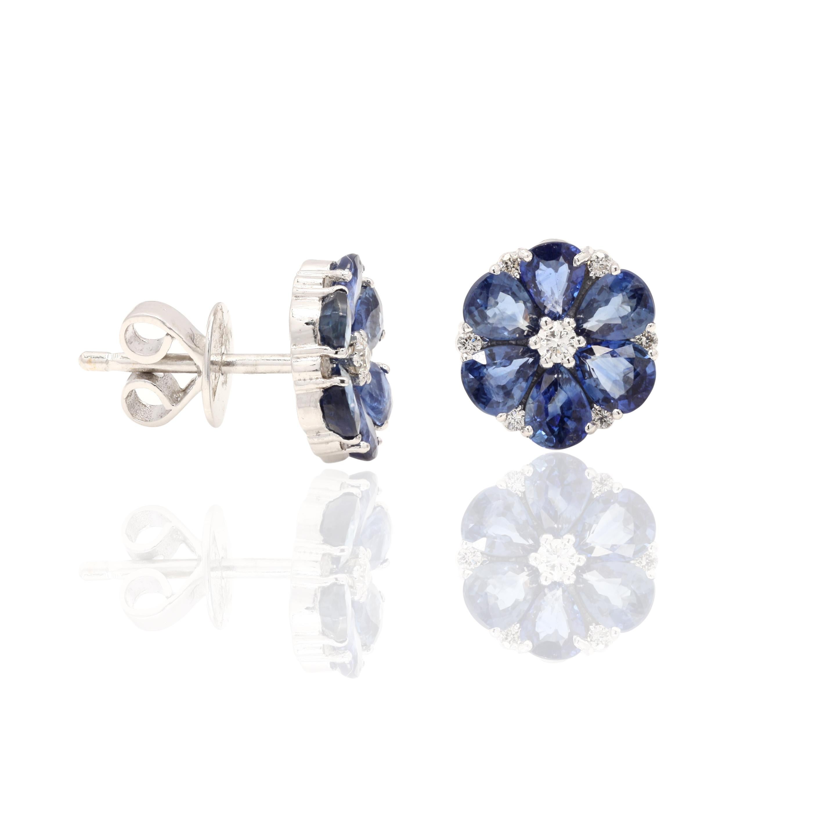 Floral Sapphire Stud Earrings with Diamonds in 18K White Gold. Embrace your look with these stunning pair of earrings suitable for any occasion to complete your outfit.
Studs create a subtle beauty while showcasing the colors of the natural precious