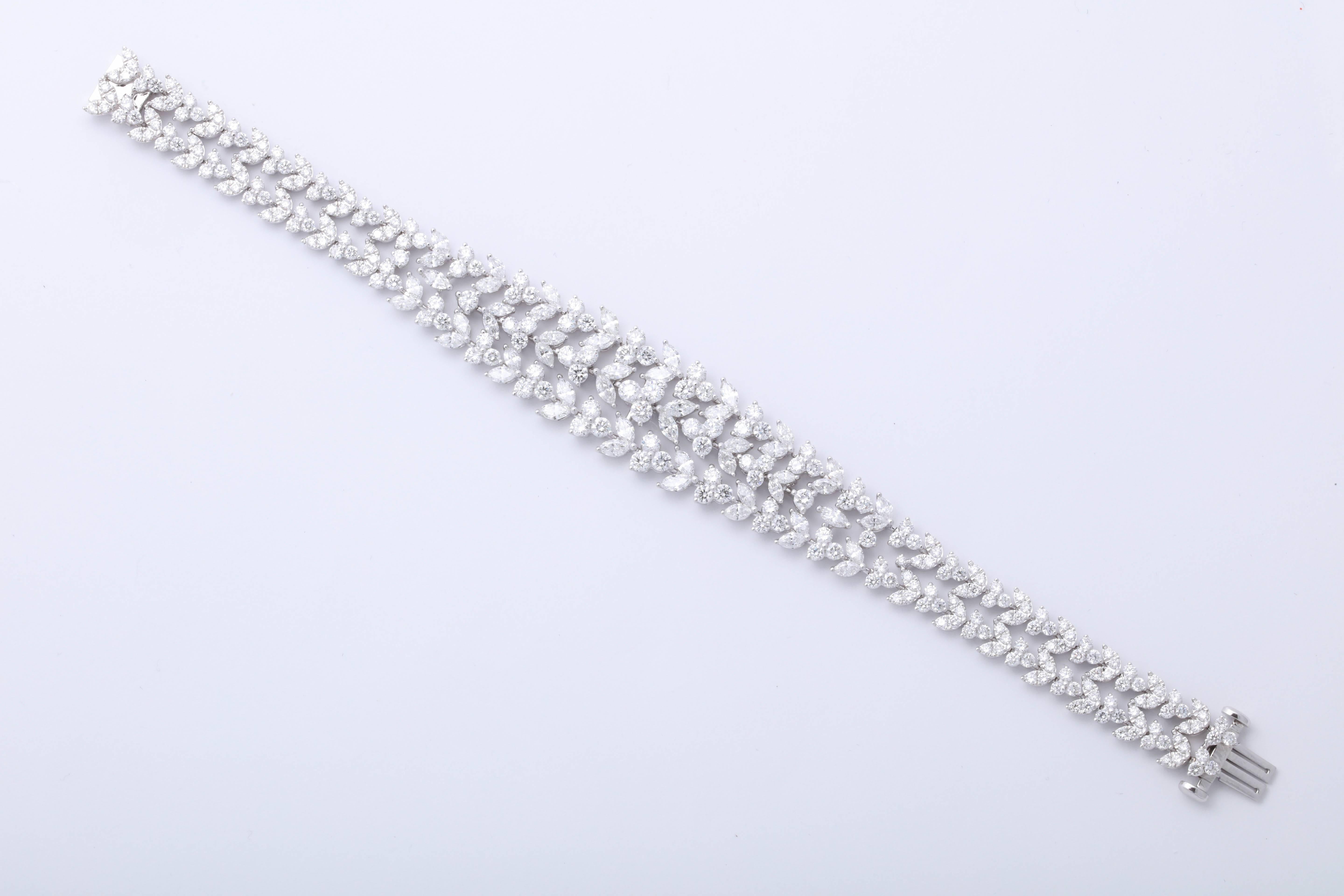 
A fabulous diamond bracelet -- a beautiful design with a large look. 

14.48 carats of white round brilliant and marquise cut diamonds set in 18k white gold 

A beautiful design and full of sparkle -- pictures do not do this piece