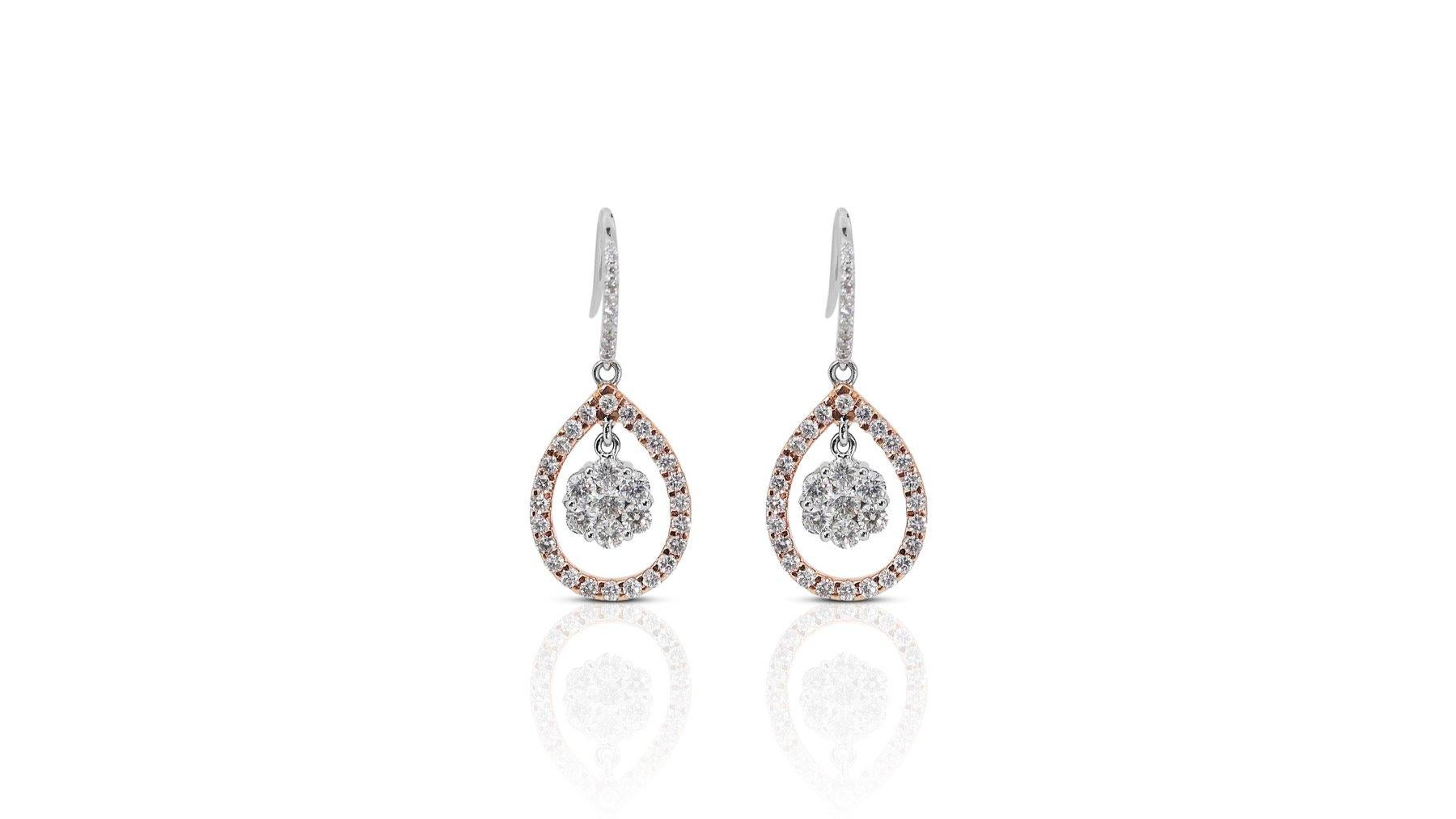 These stunning diamond earrings feature a dazzling 2.35 carat round brilliant cut diamond as the main stone. The diamond is F-G in color and VS2-SI1 in clarity, with a VG-G cut grade. The earrings are made of 18K white gold with a high quality