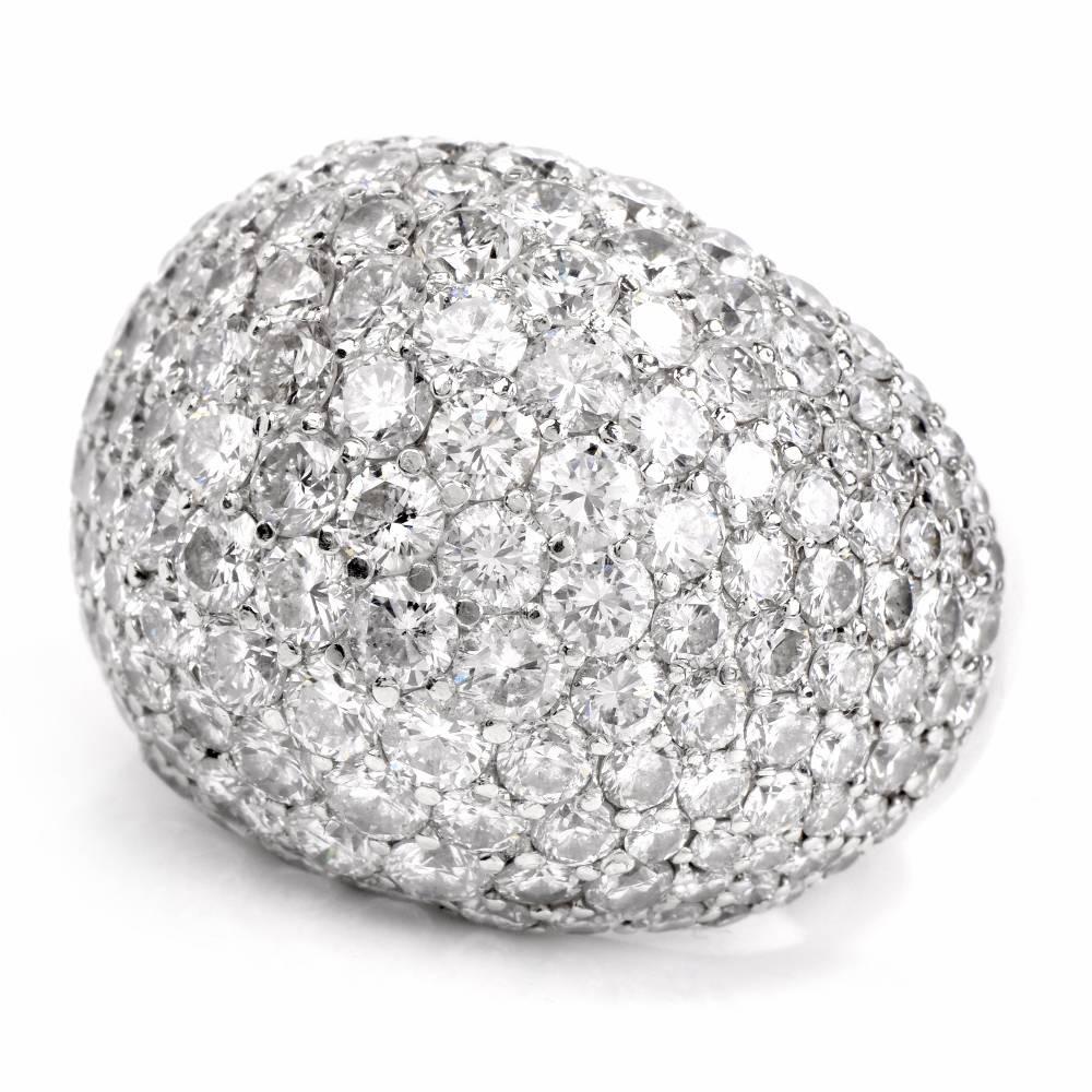 This Stunning ring with pave diamonds is designed as a bombé plaque, pave-set with 8.24cts of large round-faceted high quality diamonds graded H-I color and VS1-VS2 clarity. The ring is crafted in solid platinum, the inner décor depicting the