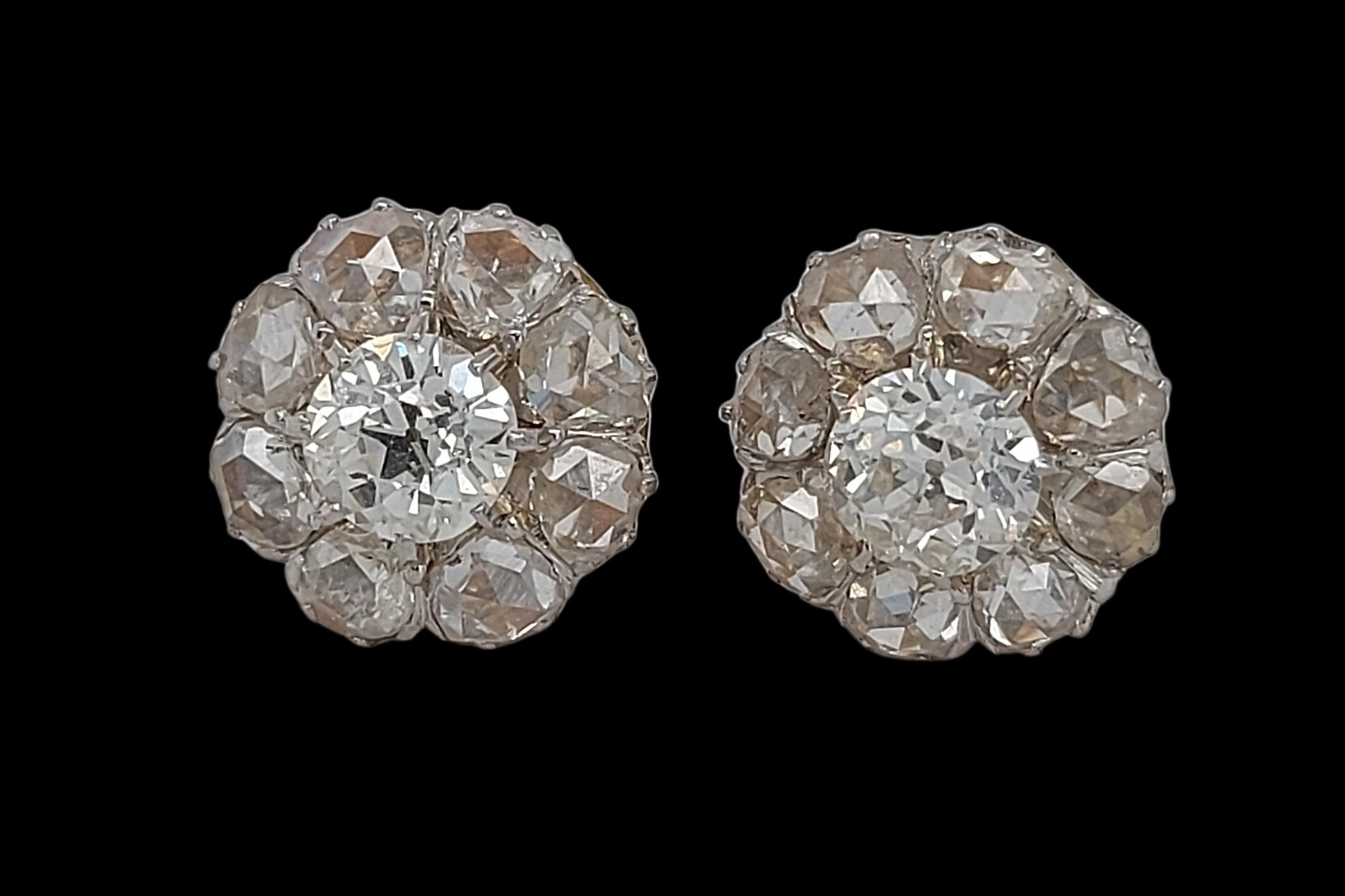 Stunning Diamond Stud Earrings in 18kt Yellow & White Gold

Diamond: Centre Diamond: round old mine cut  approx. 0.60ct each, surrounded by 8 rose cut diamonds , Diamonds are very white and clean

Material: 18kt yellow and white gold,