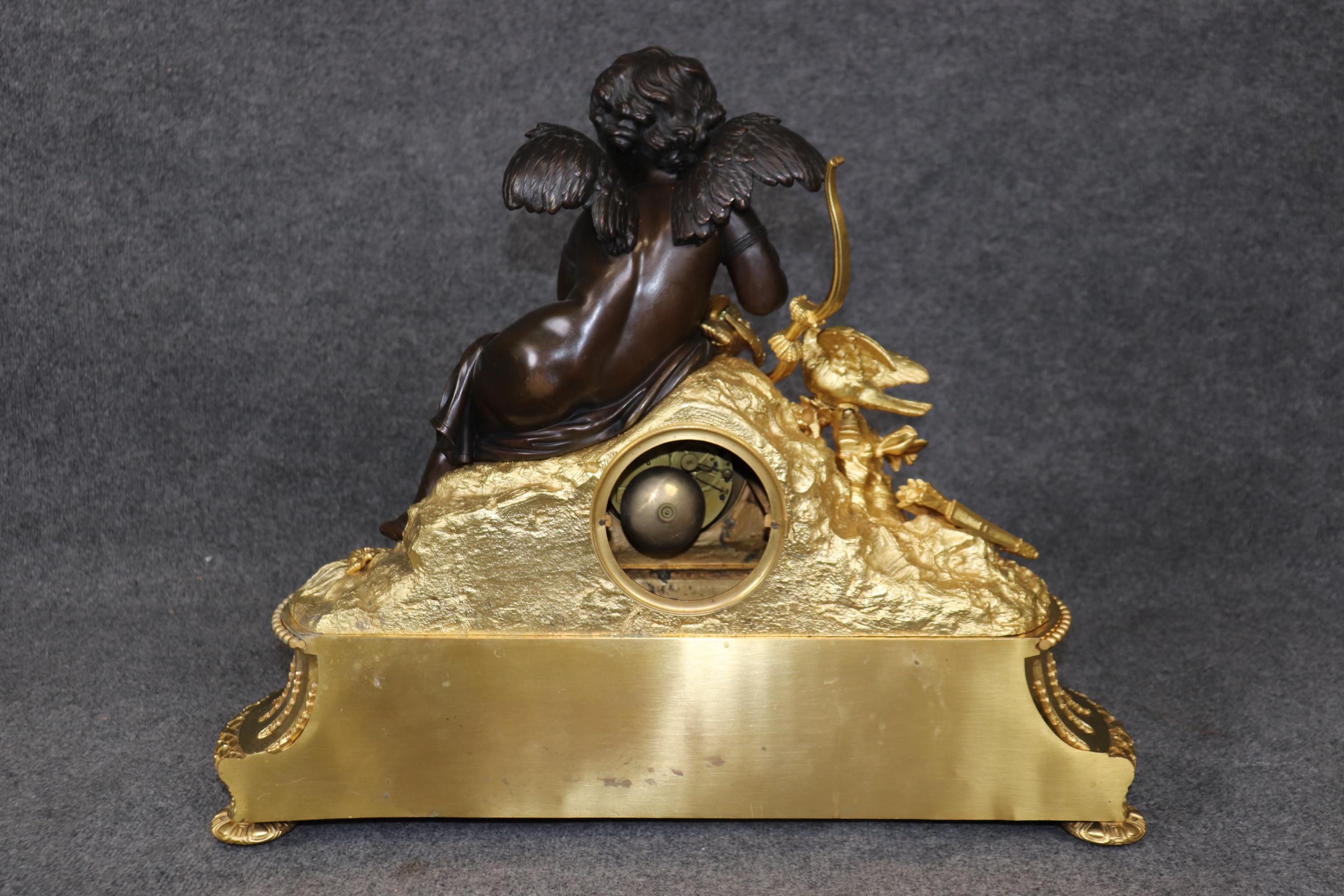 Louis XV Stunning Dore' Bronze and dark Bronze Cherub Mantel Clock by Vannier of Paris