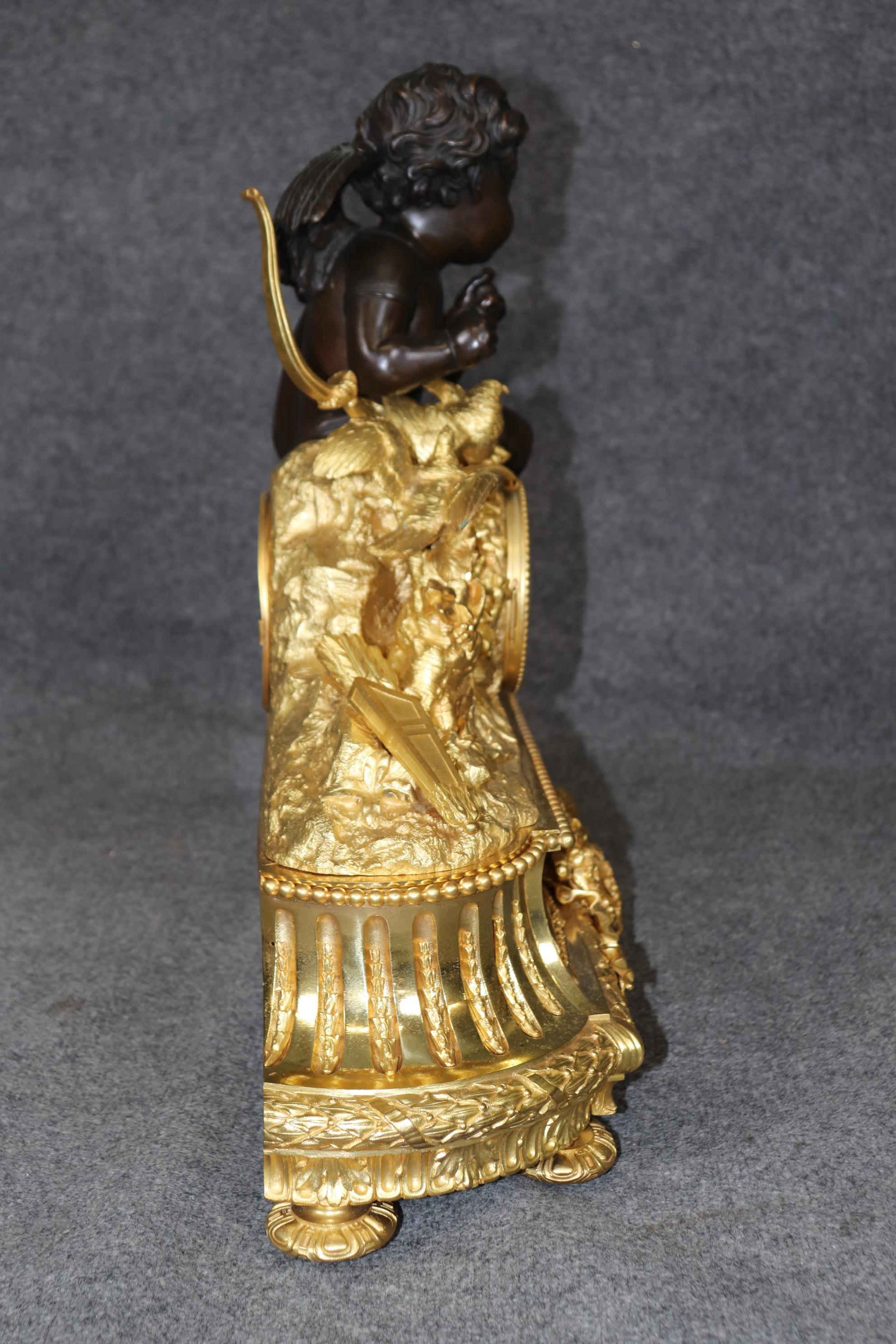 French Stunning Dore' Bronze and dark Bronze Cherub Mantel Clock by Vannier of Paris