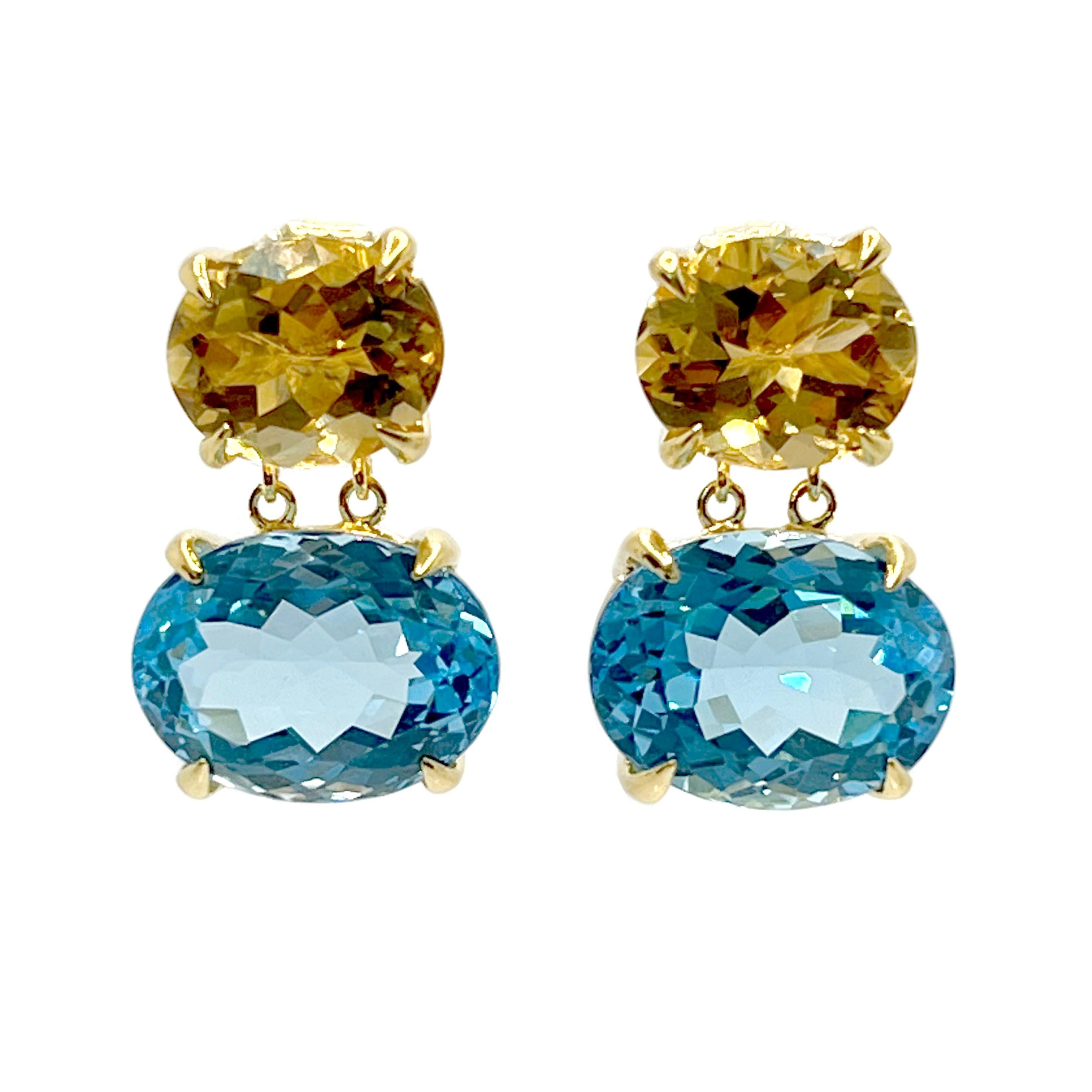 Bijoux Num Stunning Double Oval Citrine & Blue Topaz Drop Earrings

Cette paire de boucles d'oreilles est composée d'une citrine brésilienne ovale de première qualité et d'une topaze bleue 24ctw, serties dans de l'or jaune 18k vermeil sur de