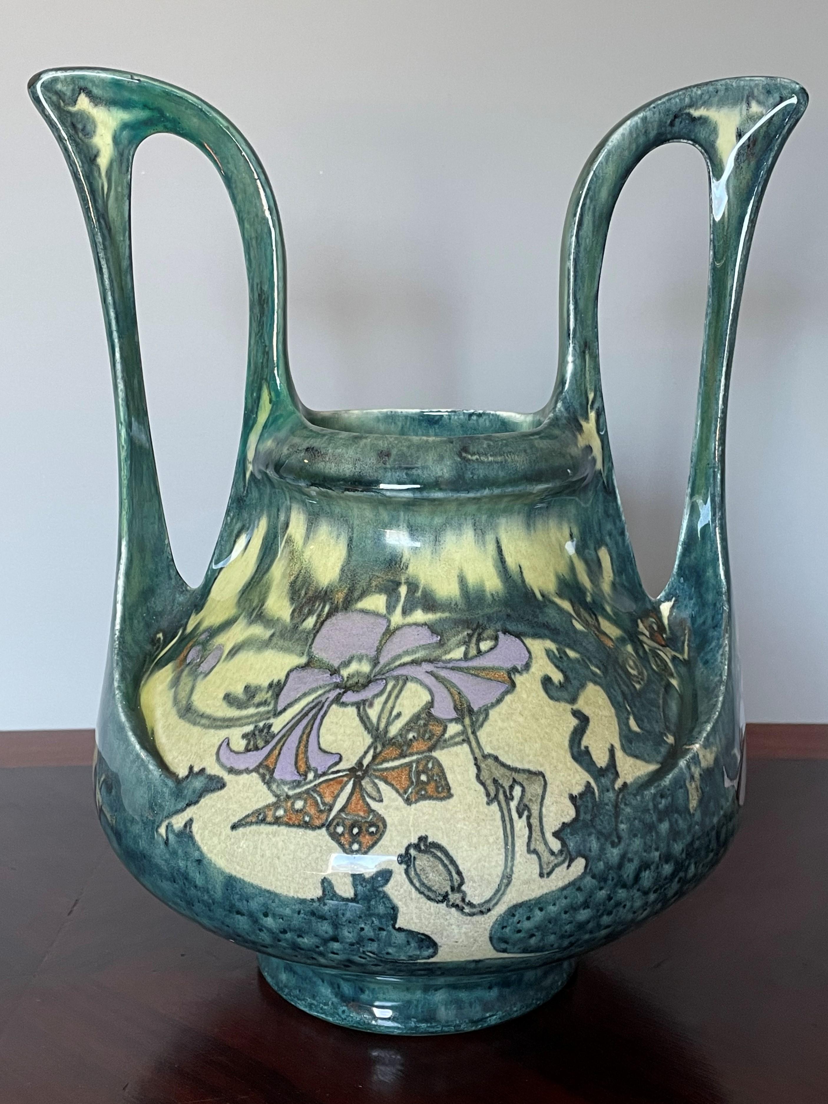 Aesthetically perfect Arts and Crafts vase with stylized butterflies and lily flowers.

If you are a lover and collector of fine art in general and of the best Arts and Crafts antiques in particular then this museum worthy vase from the late 1800s