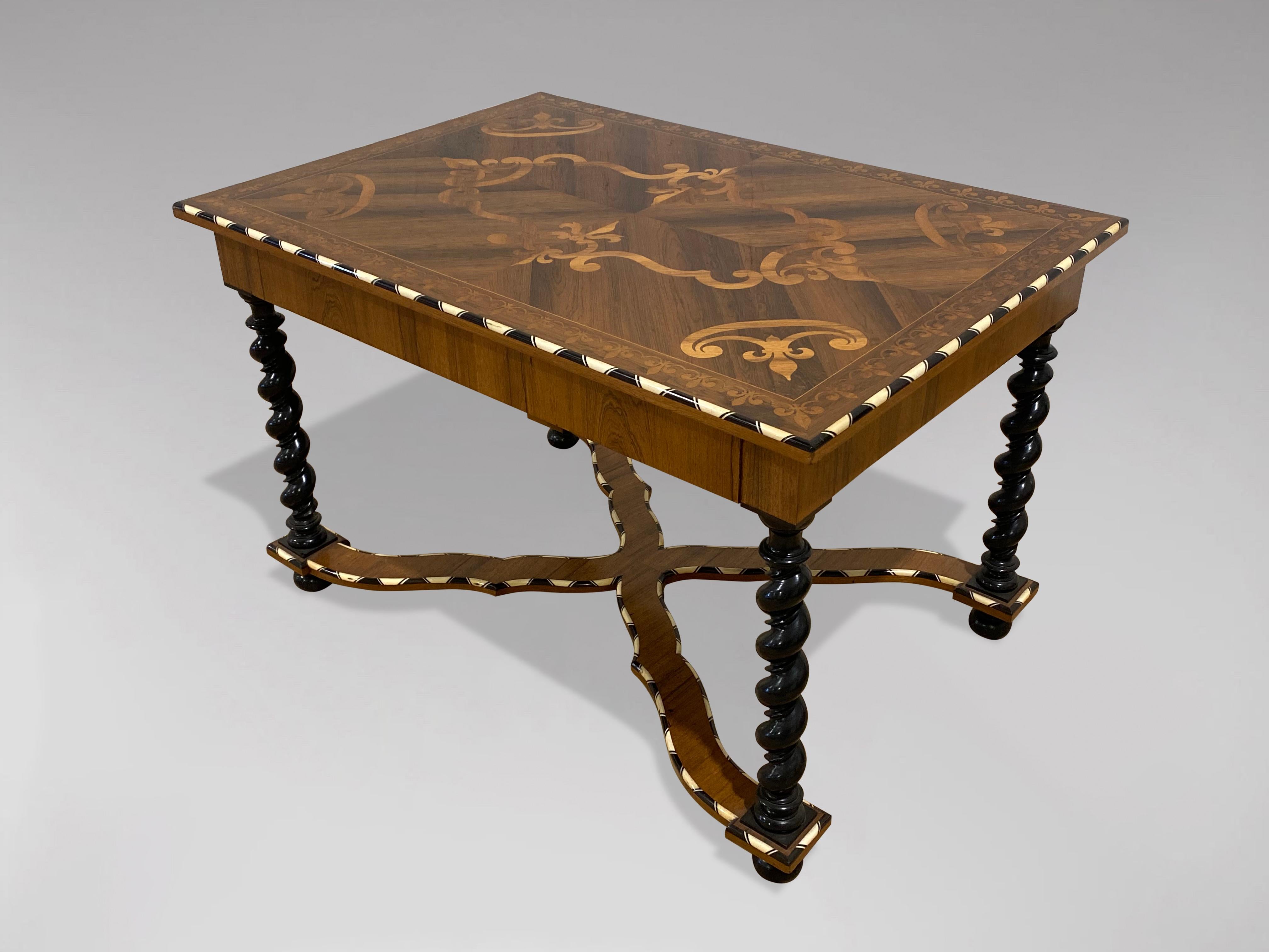 A stunning early 20th century Dutch rosewood marquetry single drawer centre table or writing table. The rectangular top with bone and ebony inlaid edge and profusely inlaid with trailing foliate and fleurs de lys motifs, above a fitted single long