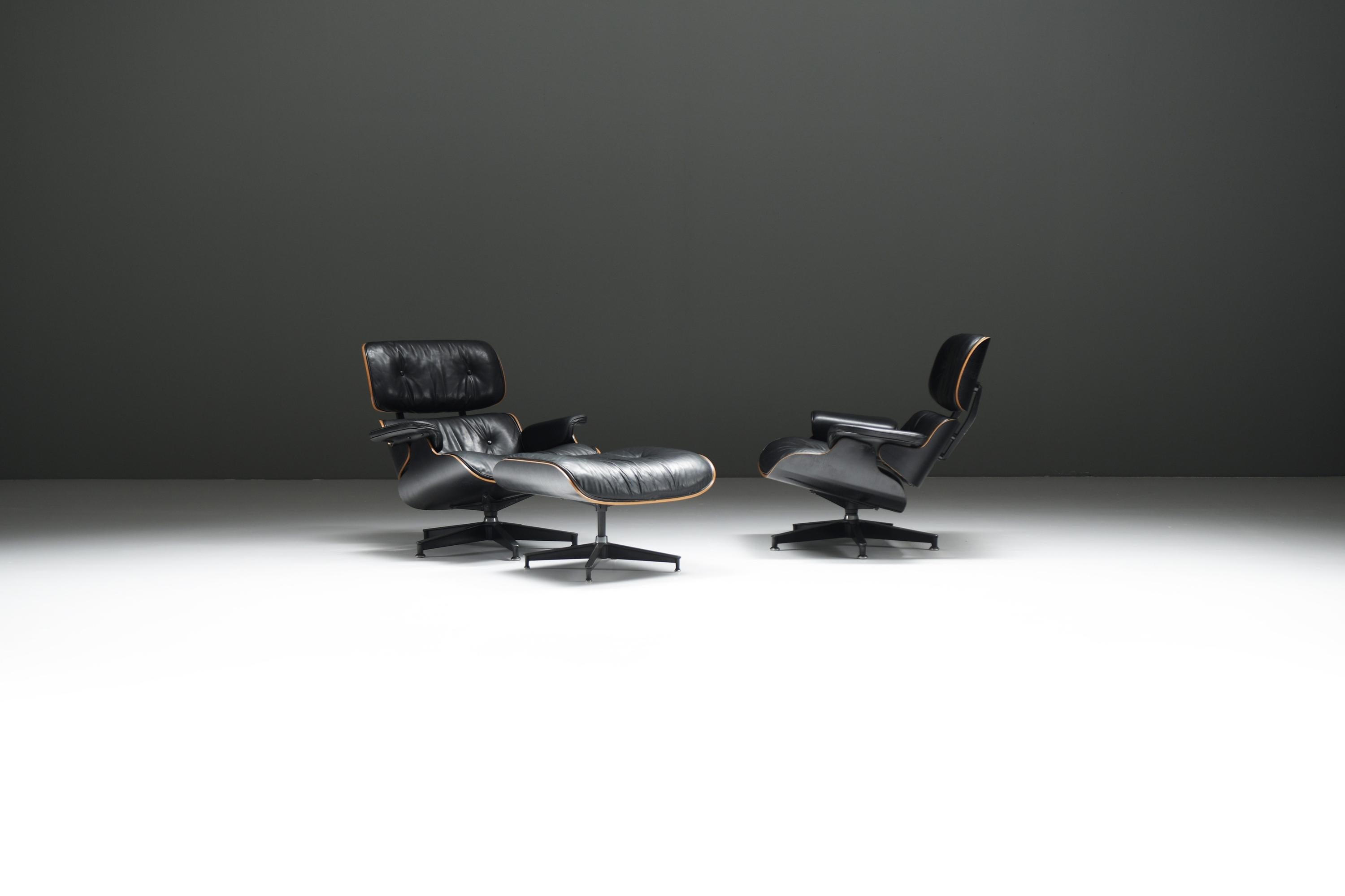 Eames Lounge Chair 670 & Ottoman 671 Set by Charles & Ray Eames, Herman Miller, 1990sBlack Patinated Leather Lounge Chairs on Ash Black Plywood Shells with Exposed Birch Edge

This remarkable, fully original matching Eames Lounge Chair set with