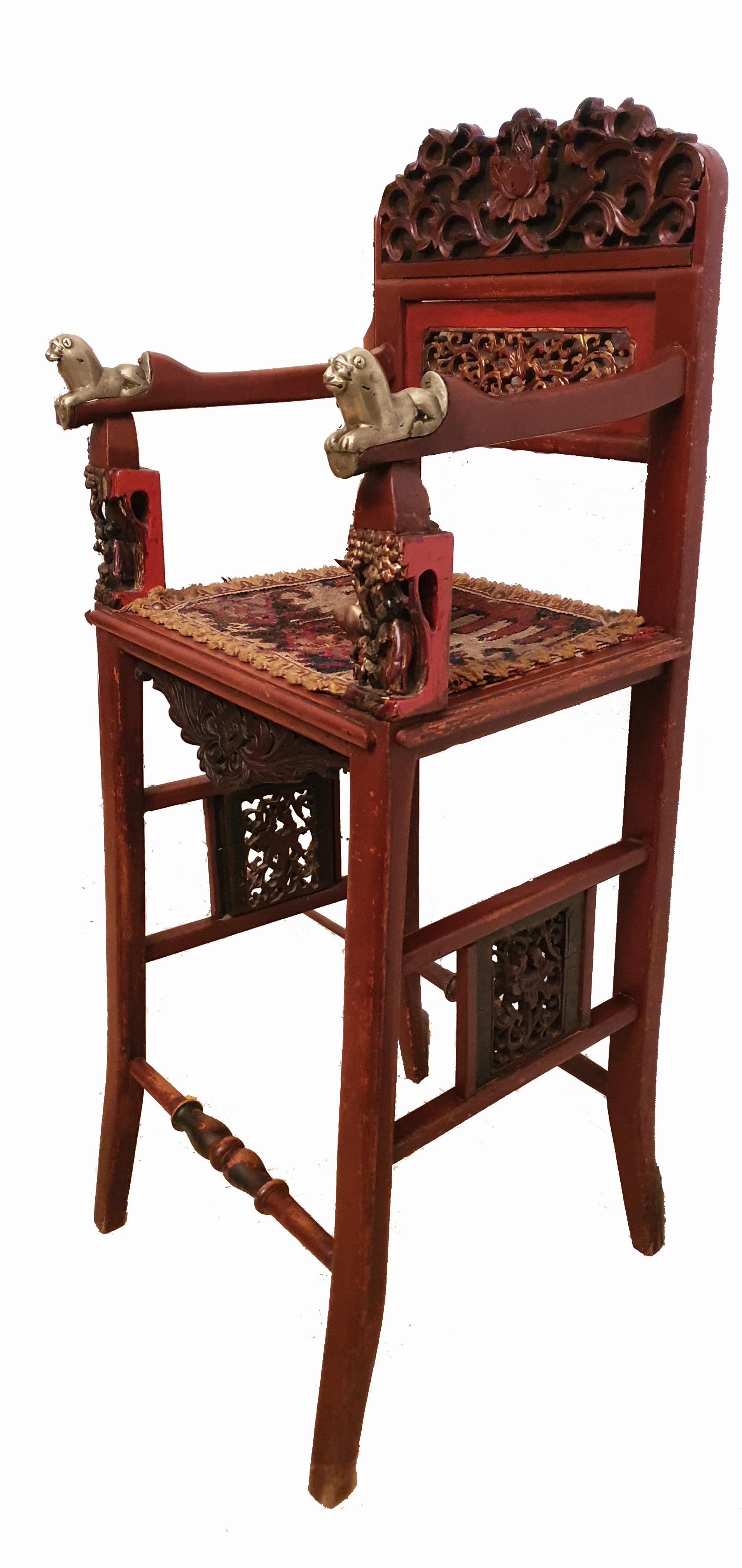 Absolutely charming and rare 19th century cinnabar lacquered royal child throne chair.

With bronze lion Couchant armrests indicating royal descent of occupying person.

Retaining the original Kilim style seat, beautifully carved with gilt and