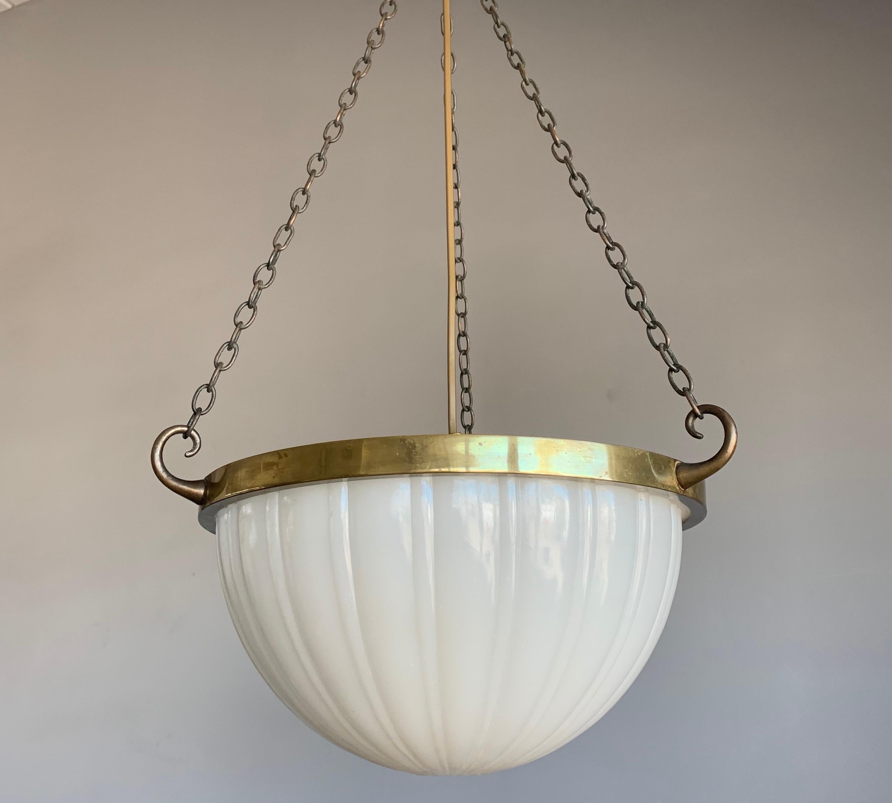 Excellent condition and shape opaline glass chandelier.

This incredibly stylish, American-made pendant is in excellent condition and it is an absolute joy to look at, both on and off. To us, this small American classical pendant can only go to one