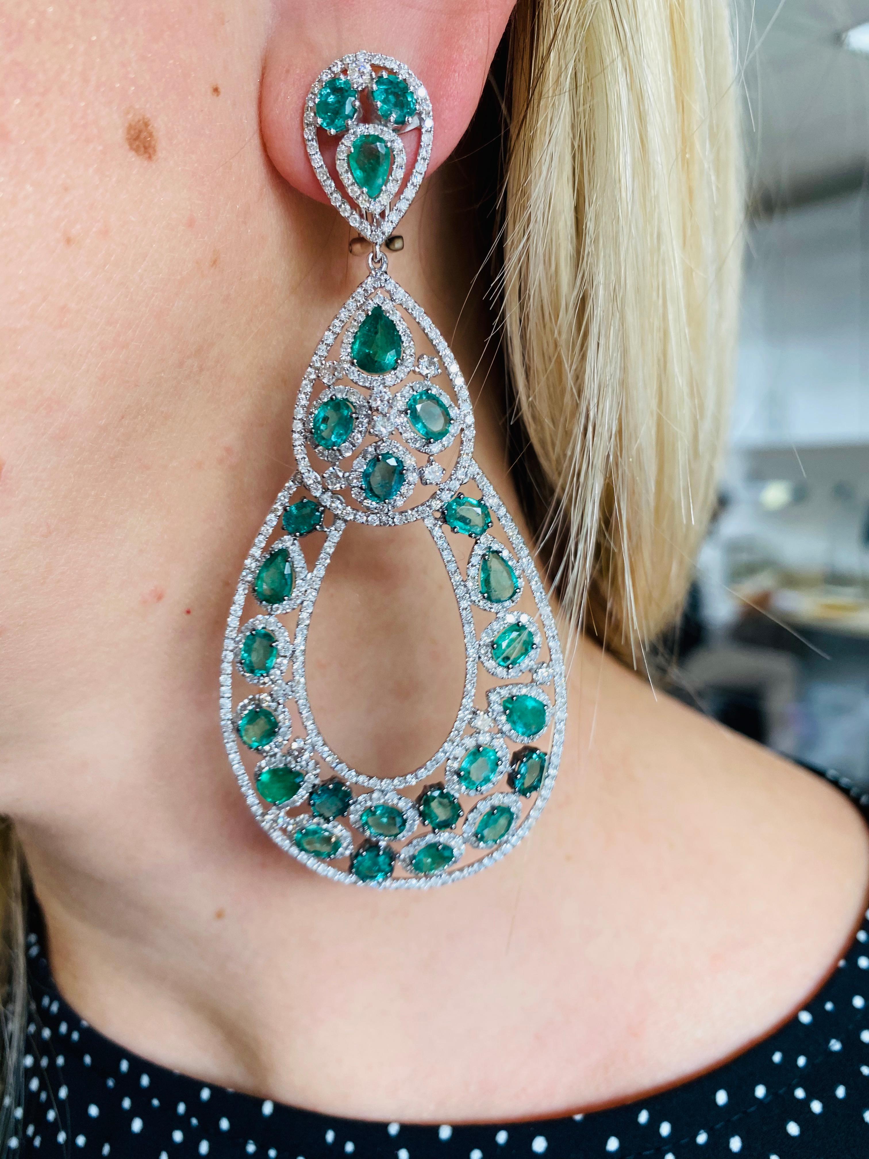 Stunning Emerald and Diamond Earrings, features 18.40 Carats of green emeralds and 9.50 Carats of diamonds. 
3 1/2