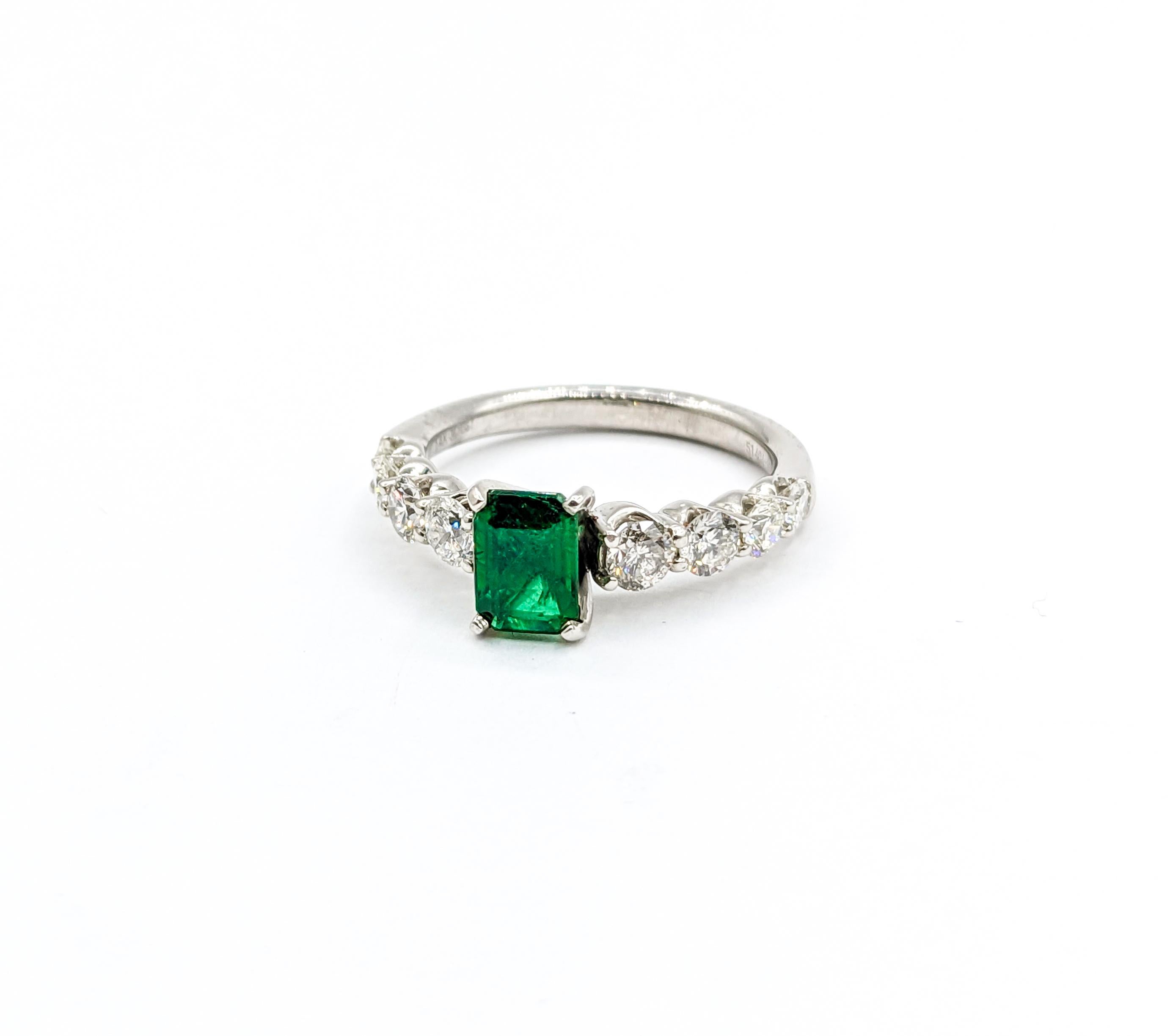 Stunning Emerald and Graduated Diamond Ring in 14K White Gold

Adorn your finger with this exquisite emerald ring crafted from 14k white gold. This ring features a stunning .89ct emerald, adding a pop of vibrant green color and sophistication. In
