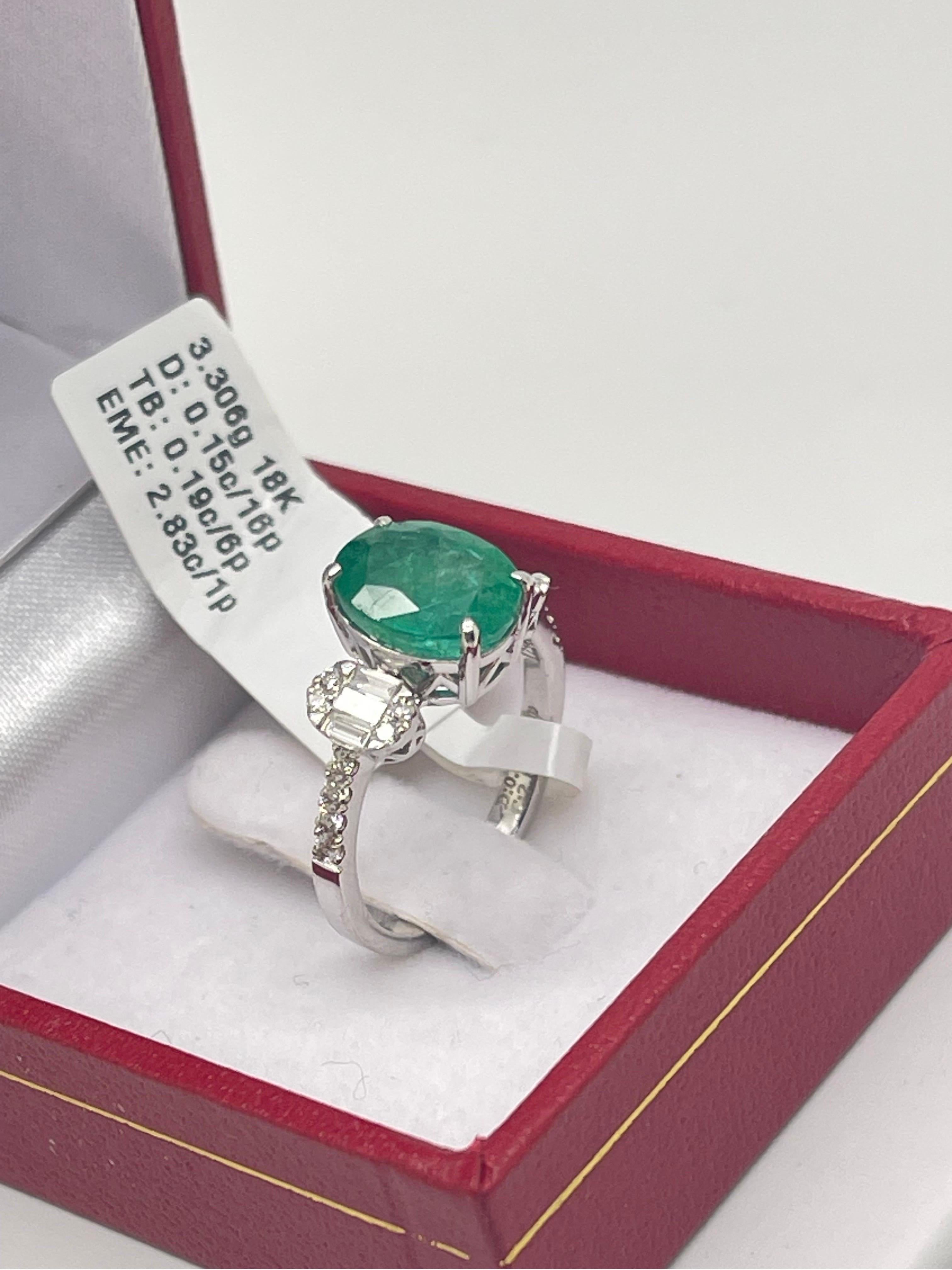 Stunning Emerald & Diamond ring In 18k White Gold.

- 2.83 carats in Emerald,

- .15 carat in round cut diamonds,

- .19 carat in baguette cut diamonds,

- Ring size 6.5