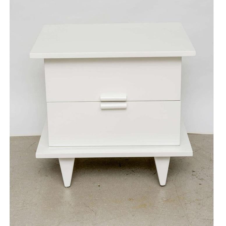 Charming pair of end tables or nightstands from a rare series, the Bali-Hi group designed by Merlon L. Gershun for American of Martinsville, one of the most respected names in the industry. Expertly constructed of solid wood and professionally