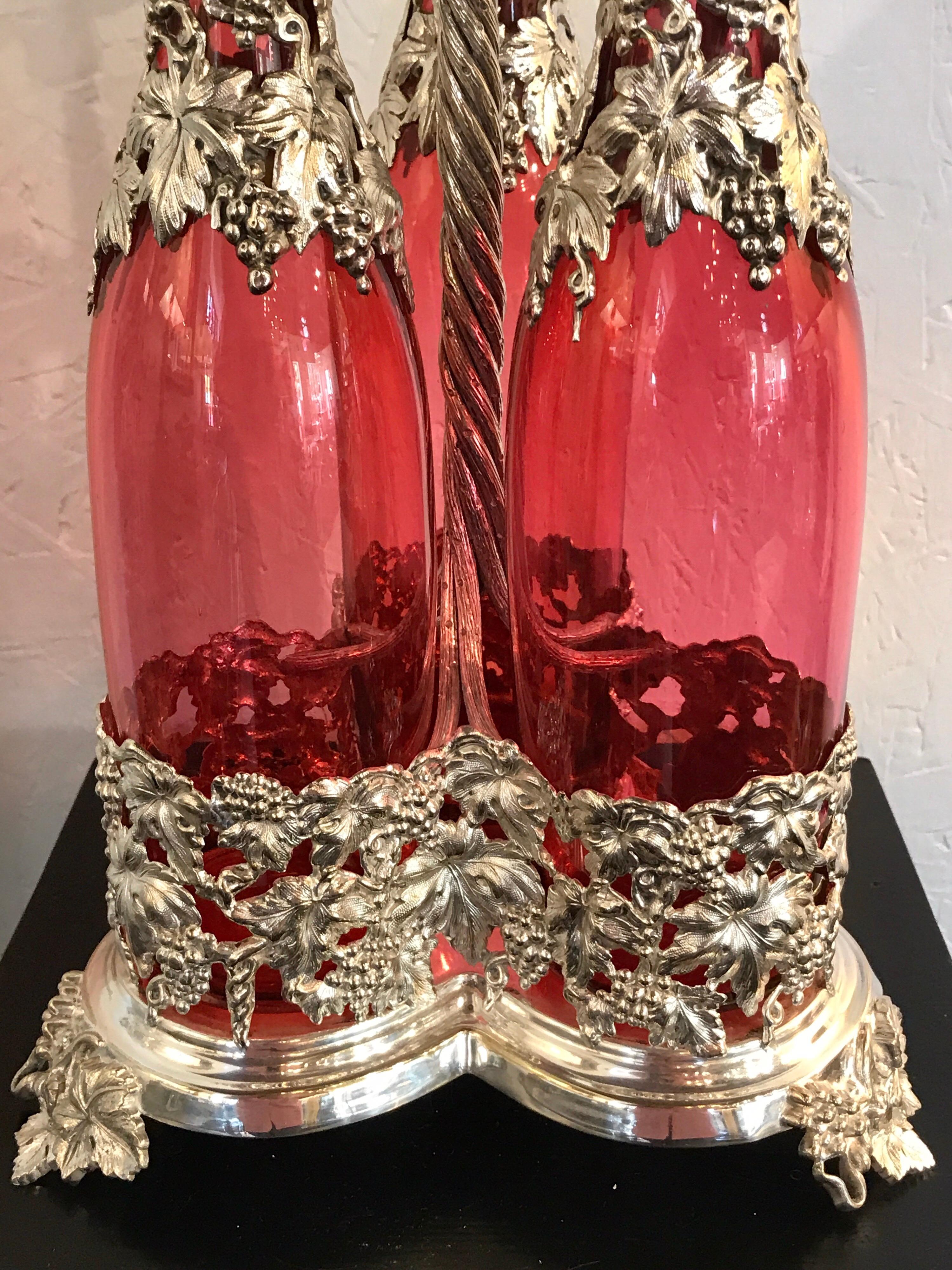 High Victorian Stunning English Silver Plate and Cranberry Glass Three-Bottle Tauntless