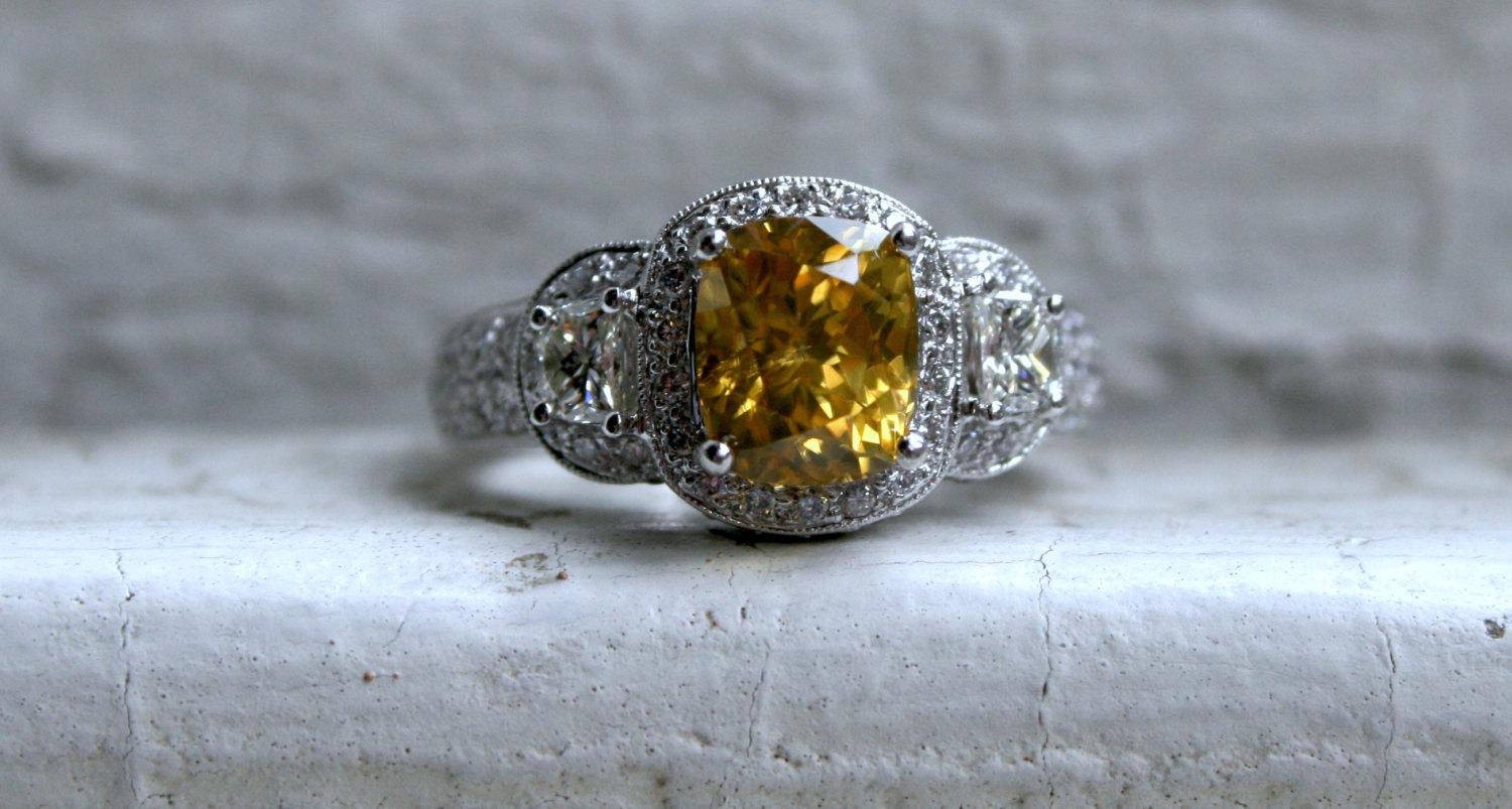 LOVE IT! This Stunning Estate Diamond and Yellow Zircon Ring Engagement Ring is really going to be hard to let go of...It looks just amazing when worn! Crafted in 14K White Gold, the ring is a classic Three Stone Pave Halo,  with a beautiful prong