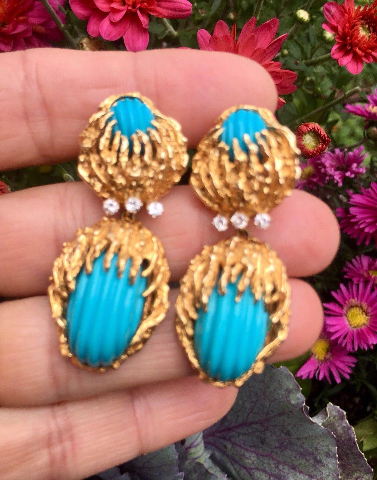 These gorgeous impressive earrings are styled in 14k bright rich yellow naturalistic free-form richly colored gold, set with two carved turquoise cabochons each, with a deep turquoise blue luster.   

The earrings are also set with 6 brilliant round