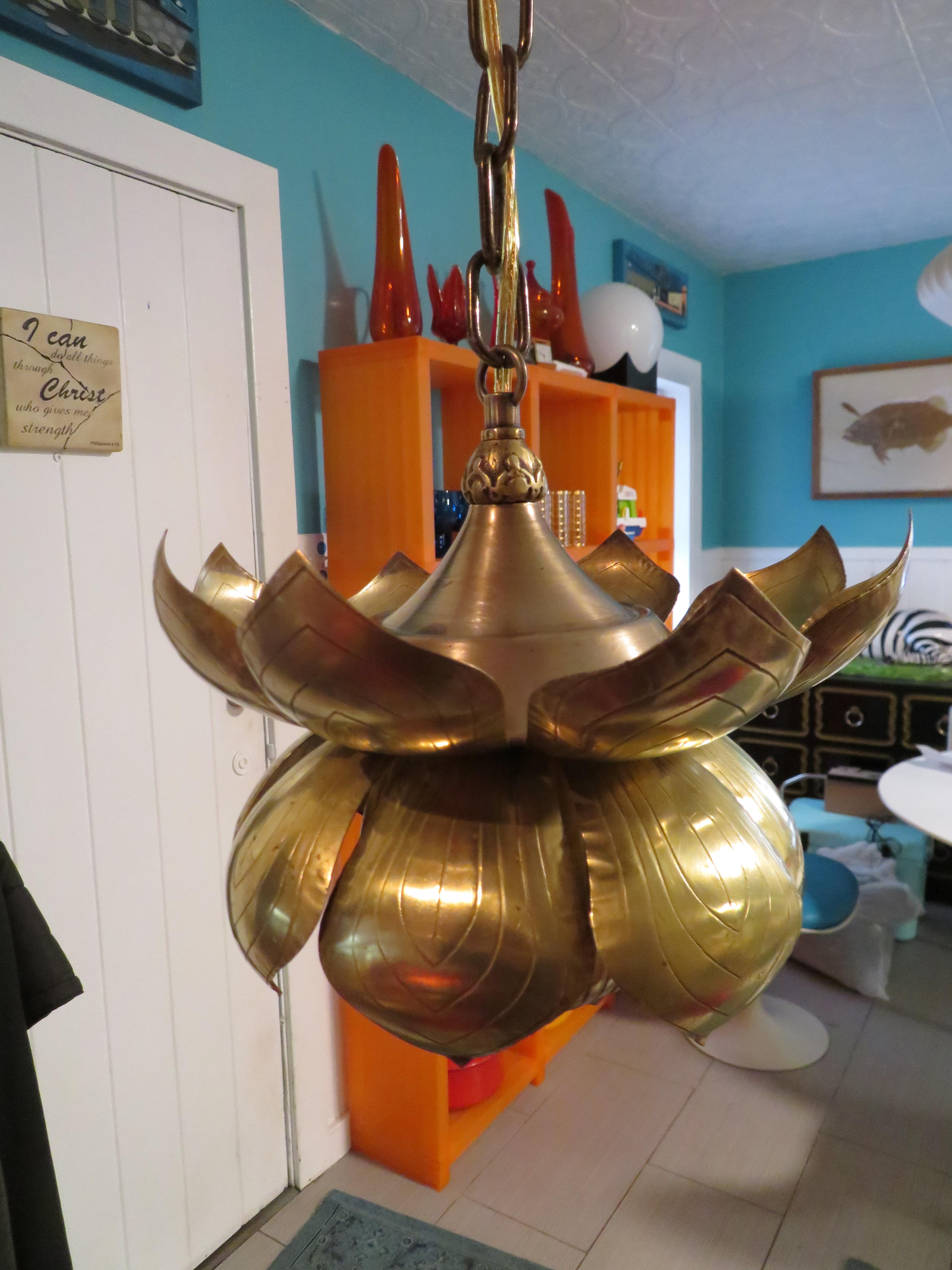 Long a symbol of purity, beauty and rebirth this lotus shaped brass pendant light is an enlightened addition to your home. Great in a hallway, entrance way or swanky powder room. High styled mood lighting for any spot that needs some vintage pizzazz.