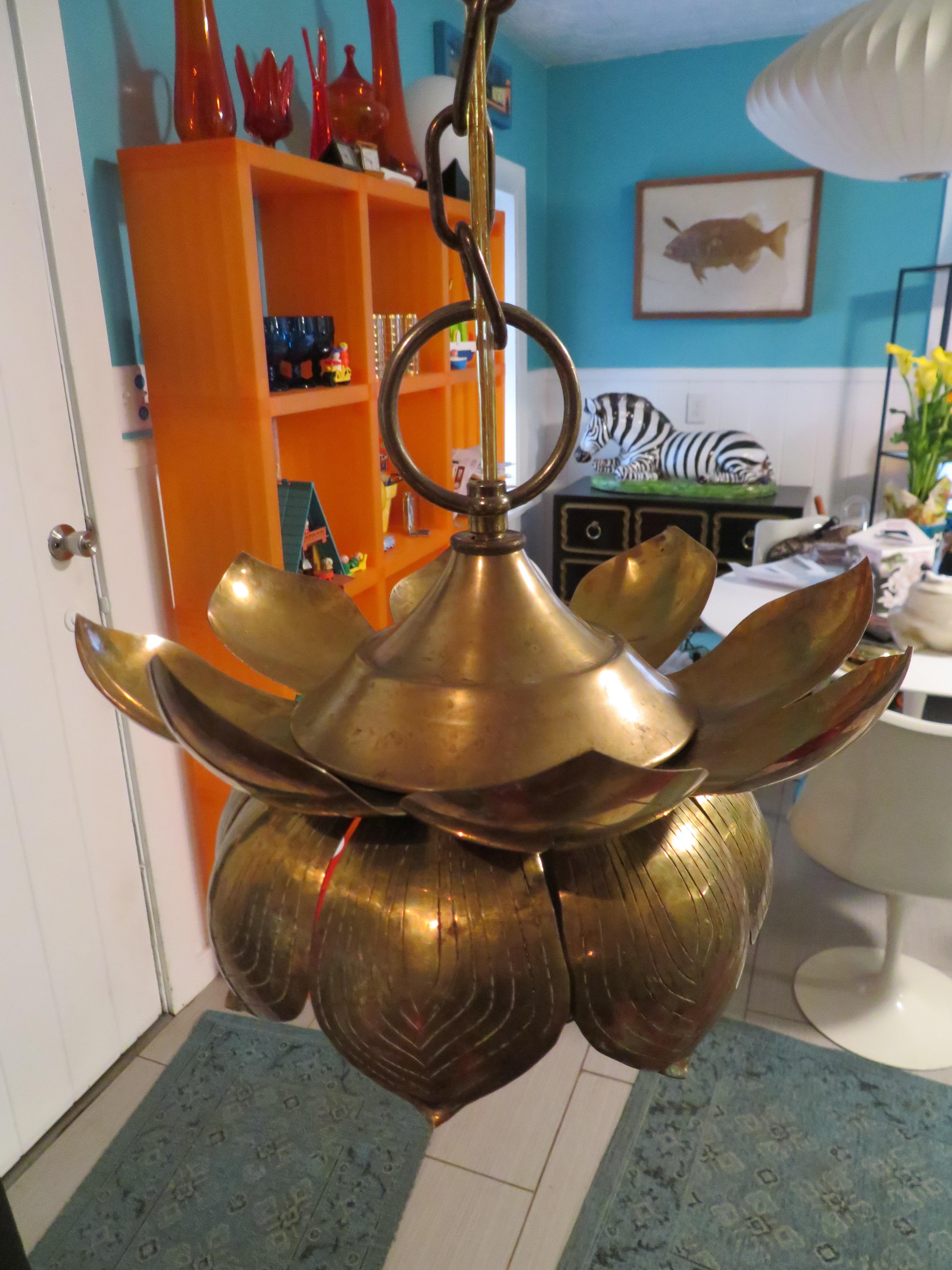 Long a symbol of purity, beauty and rebirth this lotus shaped brass pendant light is an enlightened addition to your home. Great in a hallway, entrance way or swanky powder room. High styled mood lighting for any spot that needs some vintage