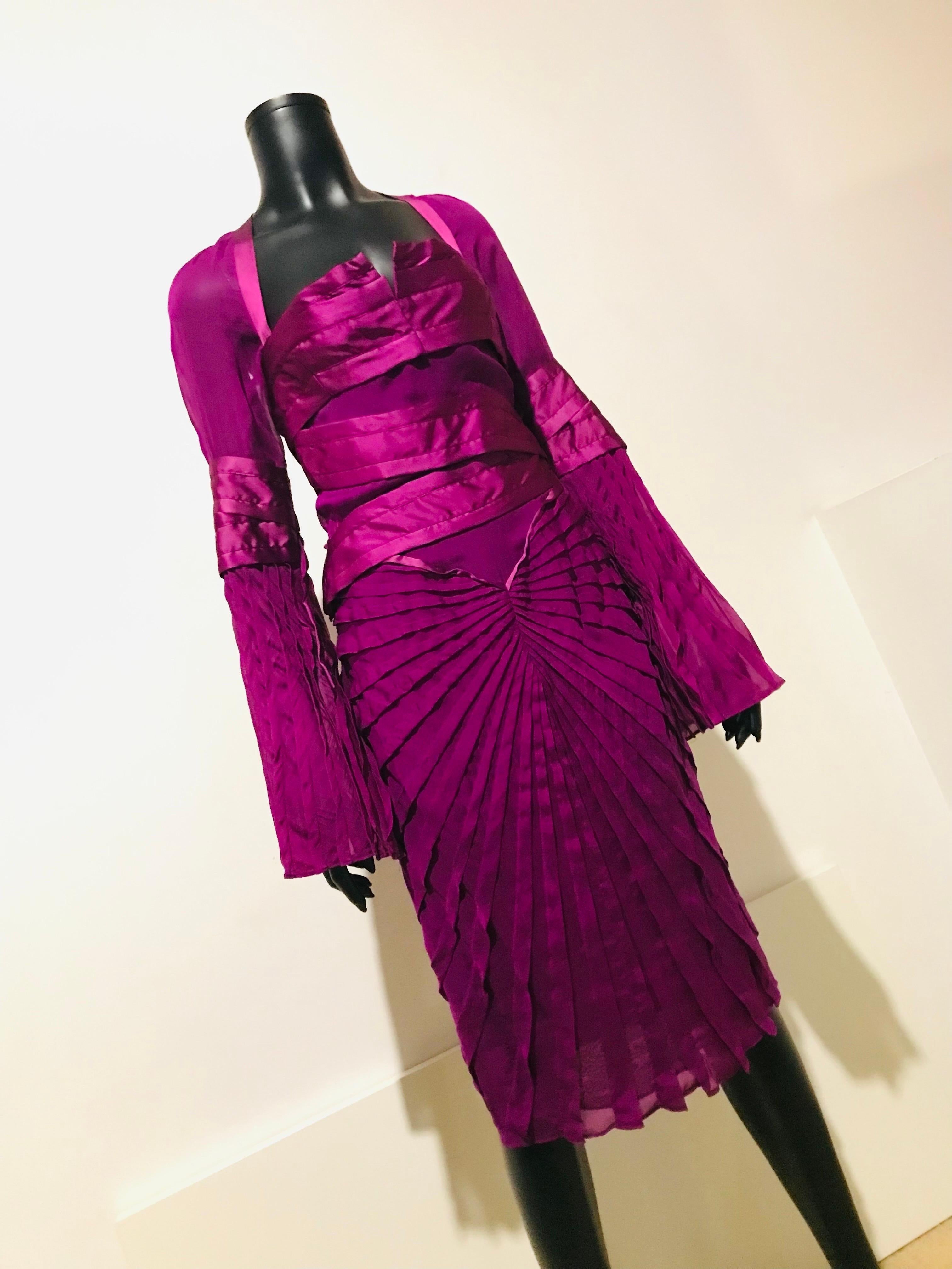 This highly collectible Tom Ford for GUCCI magenta silk cocktail dress is from his final collection at the Italian design house.

Titled Look #27 Fall/Winter 2004 collection for GUCCI it promises to be a valuable part of your designer vintage
