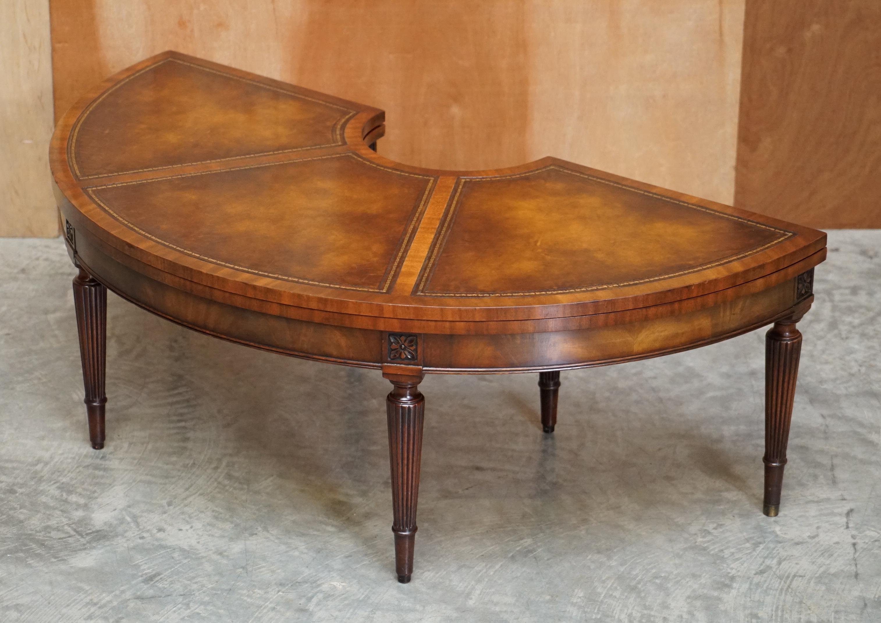 We are is delighted to offer for sale this stunning vintage hand made Flamed Mahogany, extending coffee or cocktail table with hand dyed brown leather top

A good looking well made and decorative piece, it’s very utilitarian, as you can see it can