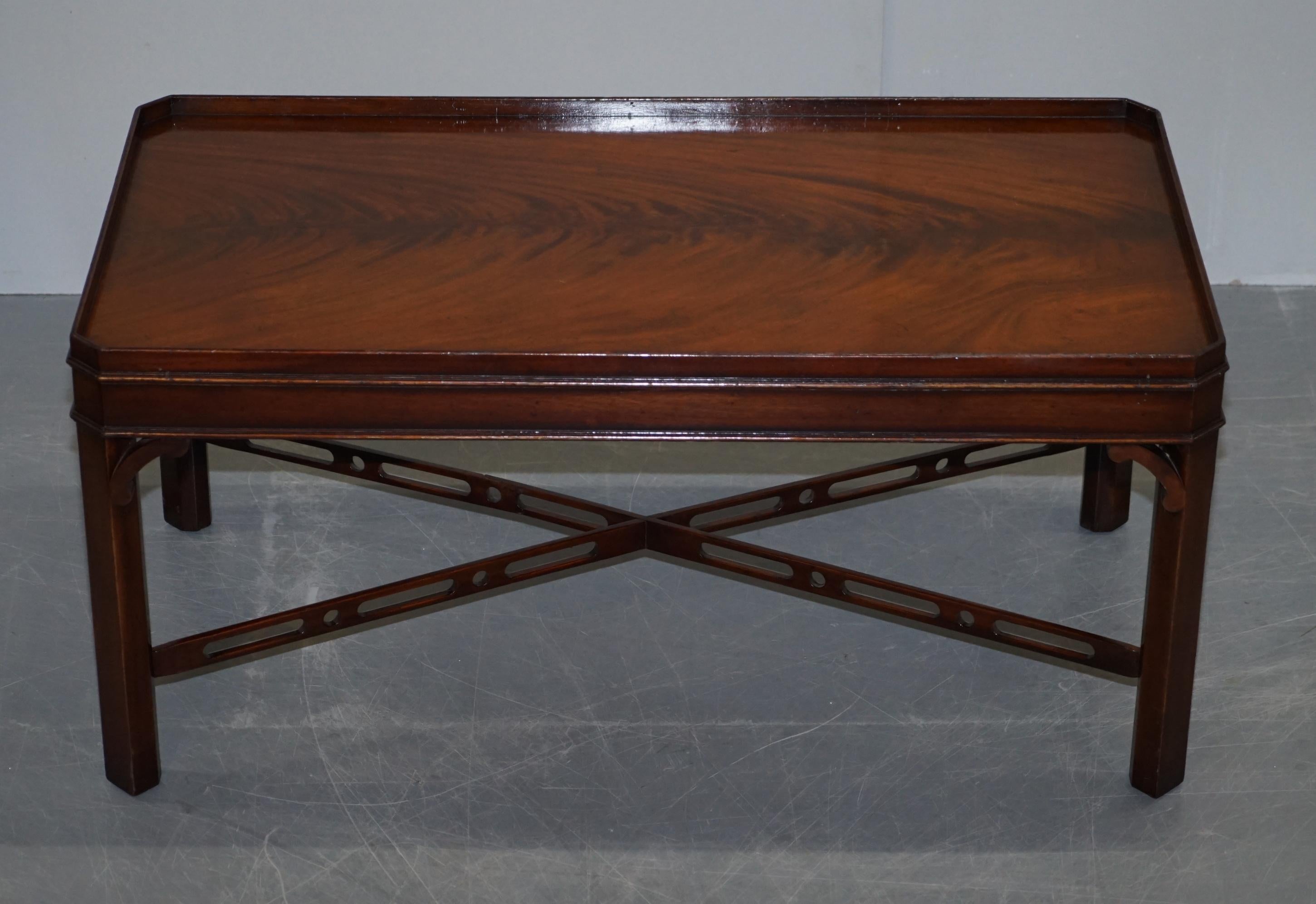 We are delighted to offer this lovely Flamed Mahogany coffee table with gallery rail and fret work carved stretchers in the Thomas Chippendale manor 

A very good looking decorative and well made piece. The timber patina is to die for, it is such