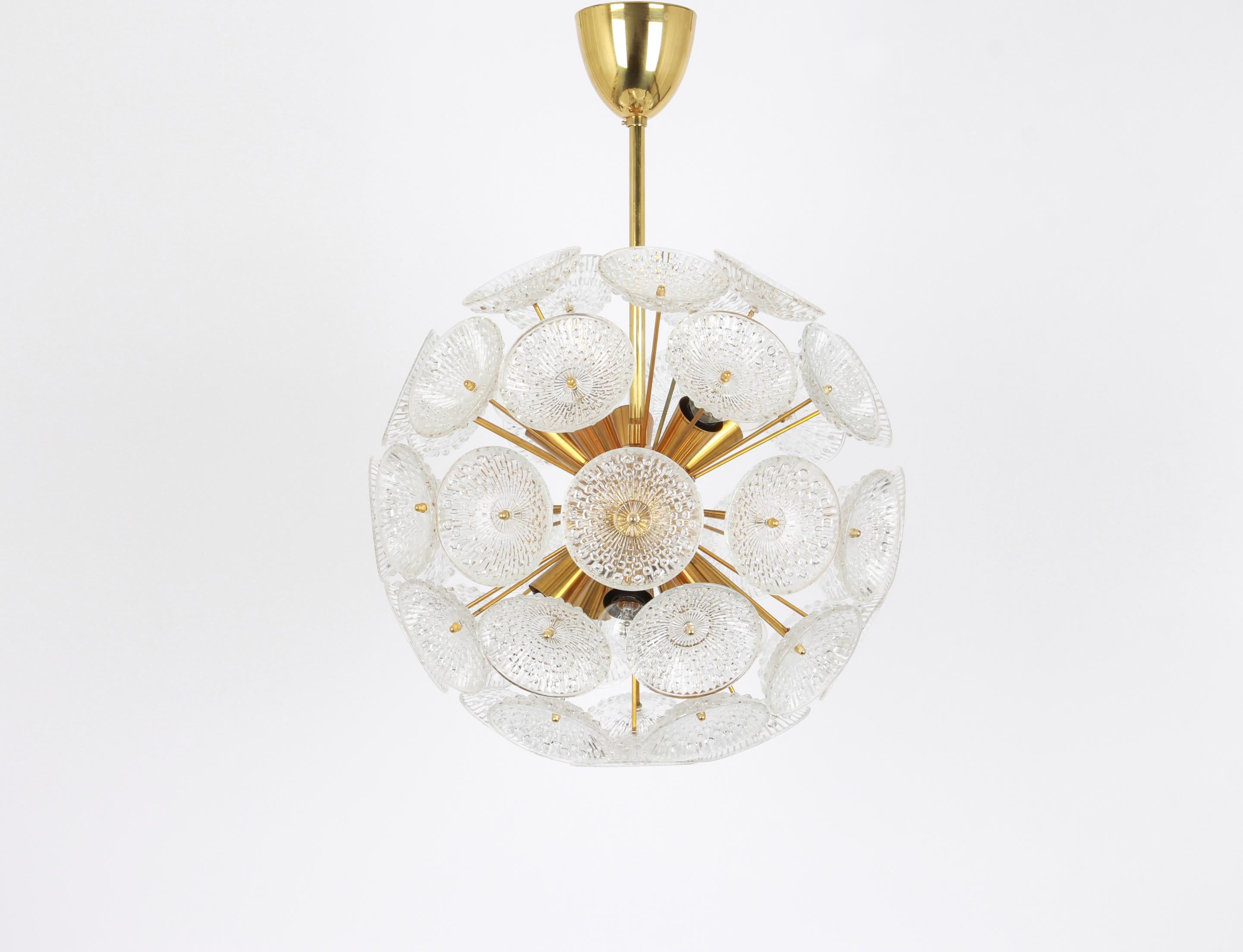 Stunning floral glass and brass Sputnik chandeliers, Germany, 1960s.

It requires 10 x E14 standard bulbs with 40W max each and compatible with the US/UK/ etc. Standards. Very good condition.
Drop rod can be adjusted as required, free of charge,