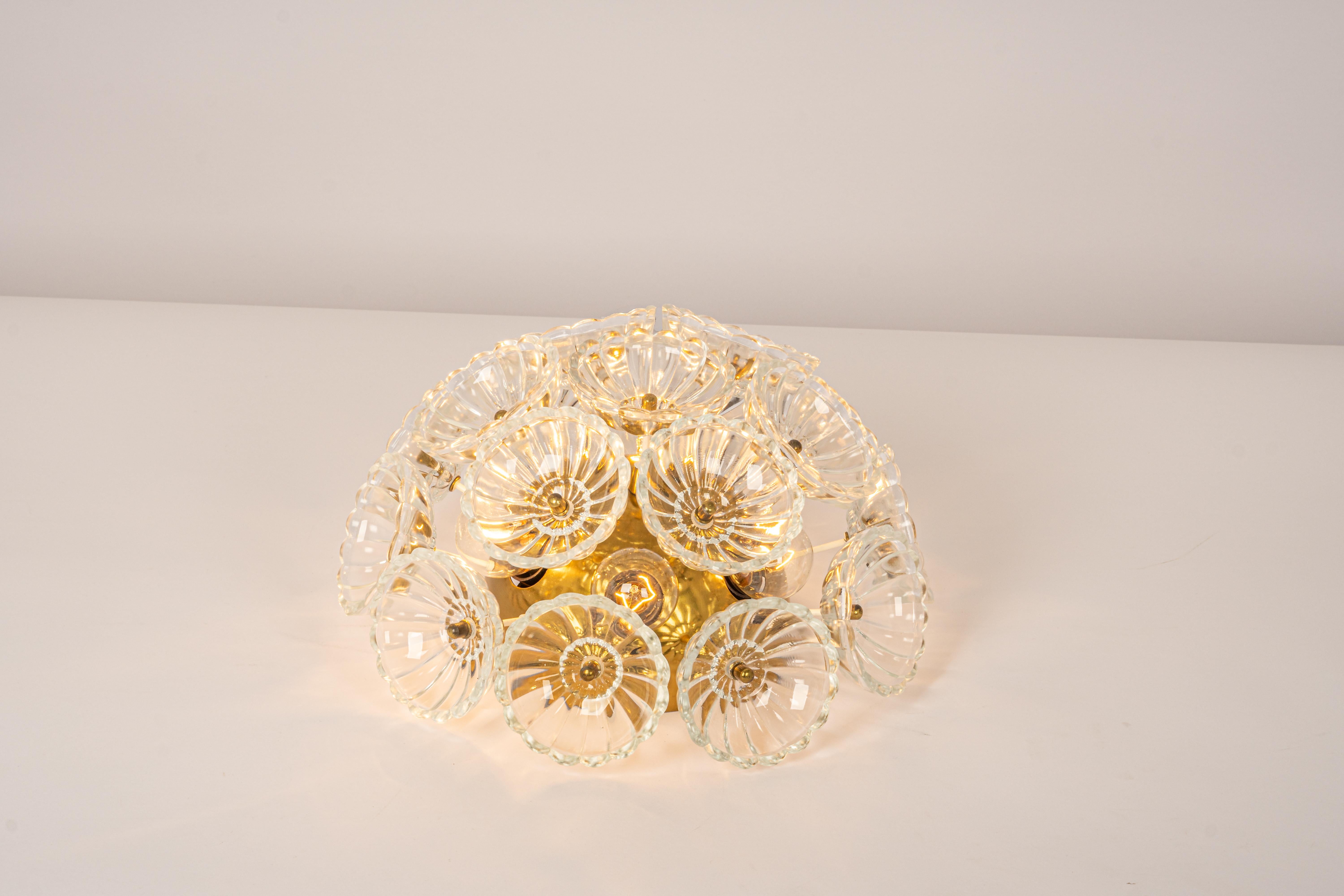 Stunning floral glass and brass Sputnik Flush mount, Germany, 1960s.
Good condition. Wonderful light effect.
It requires 6 x E14 standard bulbs with 40W max each.
Light bulbs are not included. It is possible to install this fixture in all