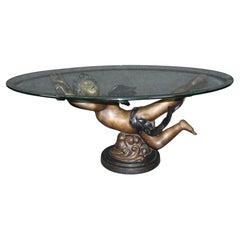 Superbe table basse en métal finition bronze ou bronze, avec putti volant ou chérubin