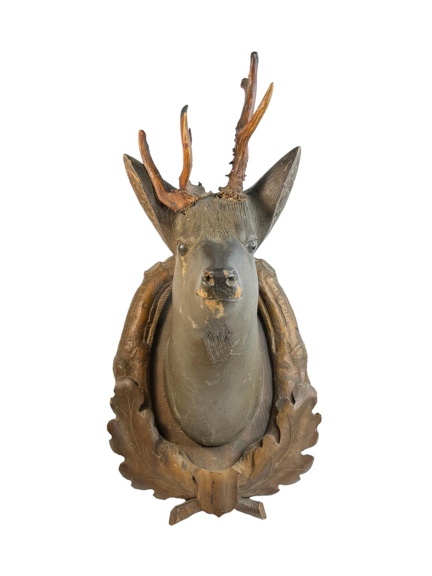 A great looking hand carved original wooden Folk Art deer head wall decoration. A great piece for a suitable ambiance in a trophy room or the office of a Hunter or Woodsman. More than likely one of the Folk Art items made between 1890 and the late