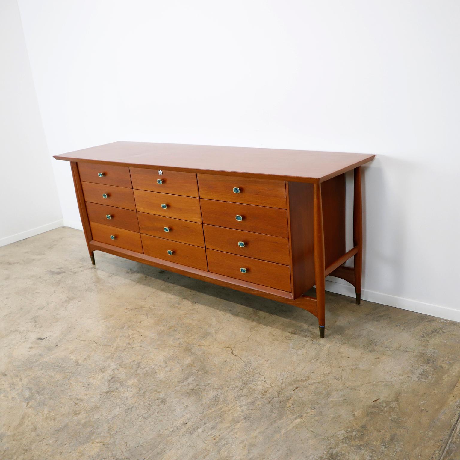 If you are searching for a piece that represents the most iconic and amazing Mexican Modernist era, we have for you this stunning and rare Frank Kyle Drawer, custom made in México city, circa 1950. The 12 beautiful pulls are designed by Pepe Mendoza