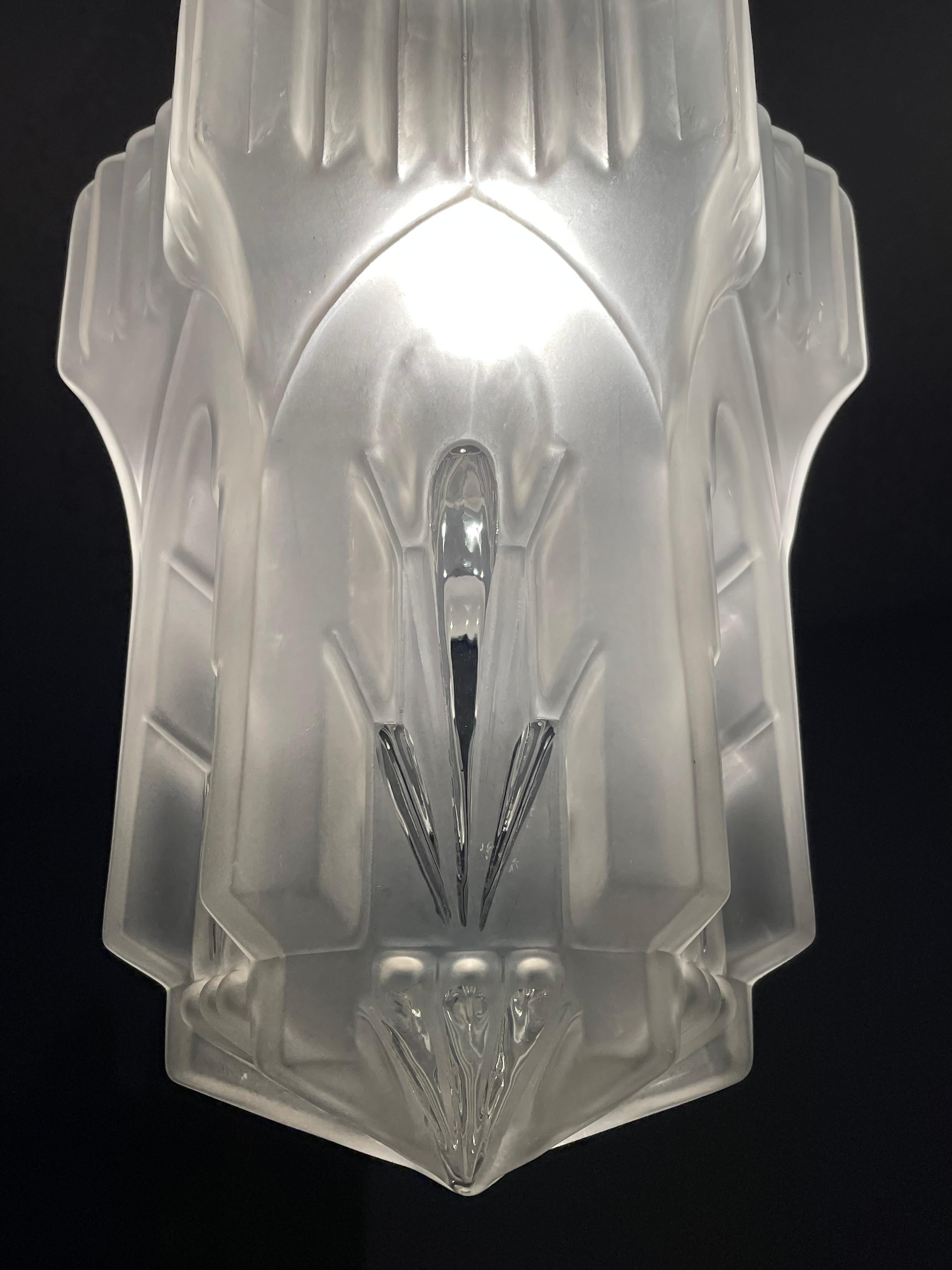 Excellent condition and marvelous design, glass-art pendant.

This incredibly stylish, french-made pendant is in excellent condition and it is an absolute joy to look at, both on and off. Its good size and timeless geometrical Art Deco design