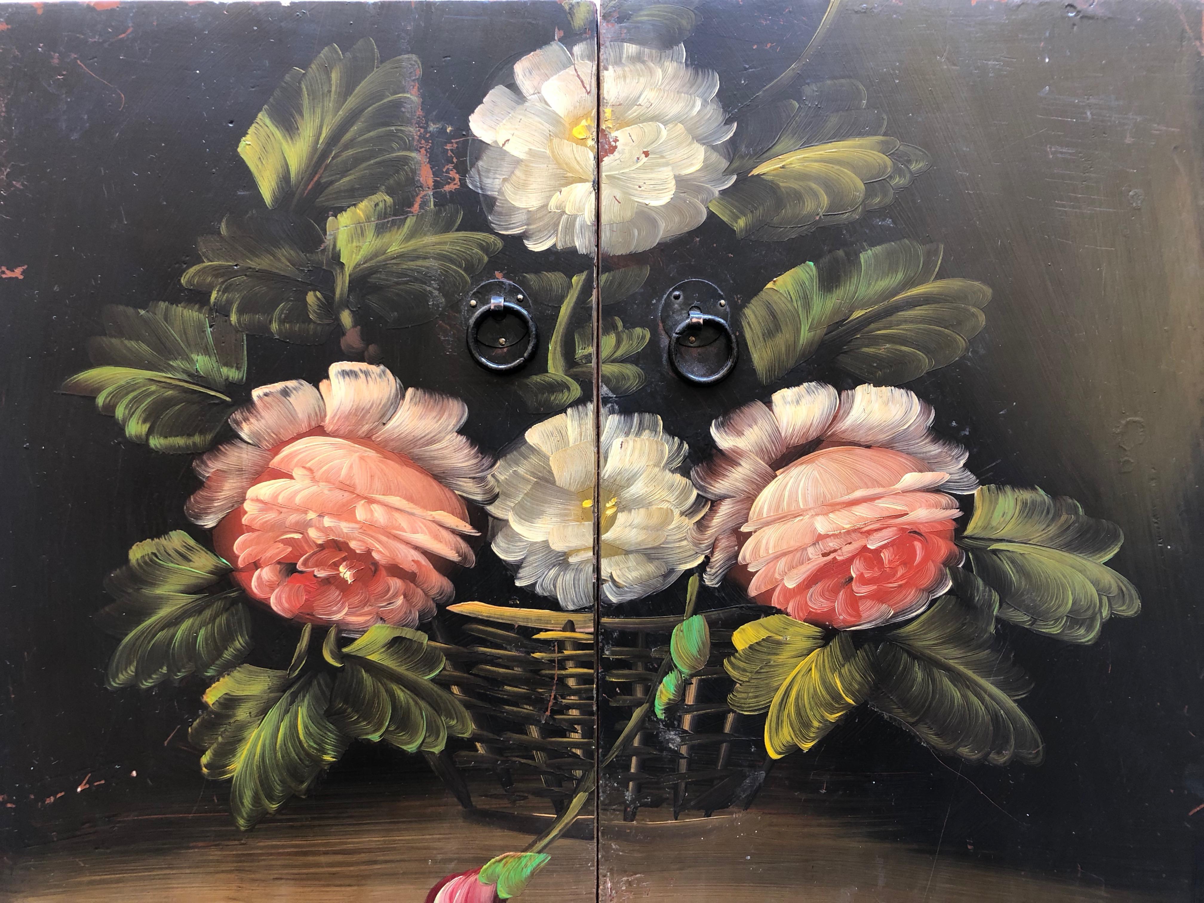 This French antique pair of hand painted cabinet doors with flowers is truly incredible. The detail and colors painted on each door is stunning and the two doors closed are an amazing original work of art that could be hung as they are, used as