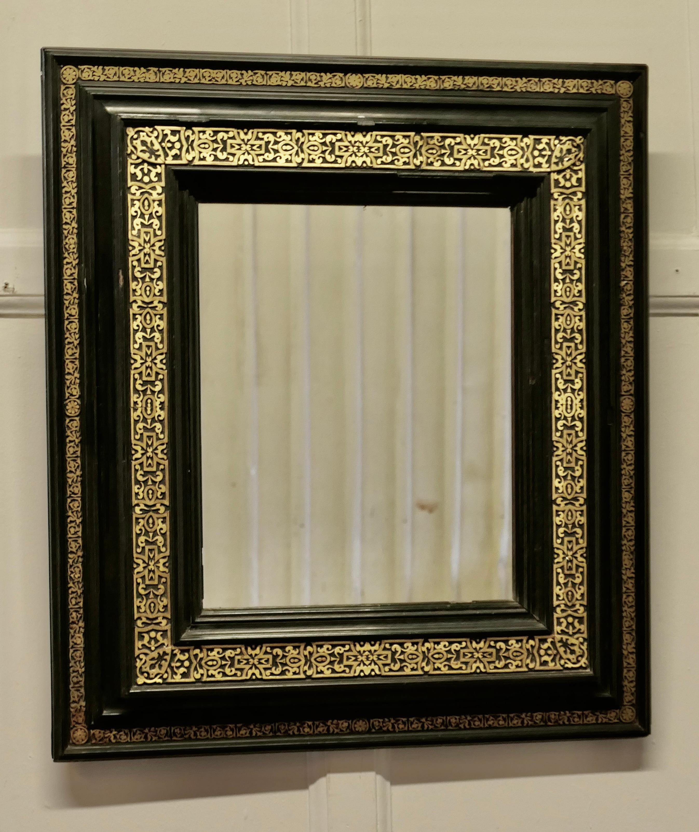 Stunning French Empire Gilt Brass and Black Lacquer Wall Mirror

This is a wonderful piece, the deeply moulded rectangular stepped frame is decorated with a 5” wide pierced brass border,
This is a very lovely piece it is in good condition for its