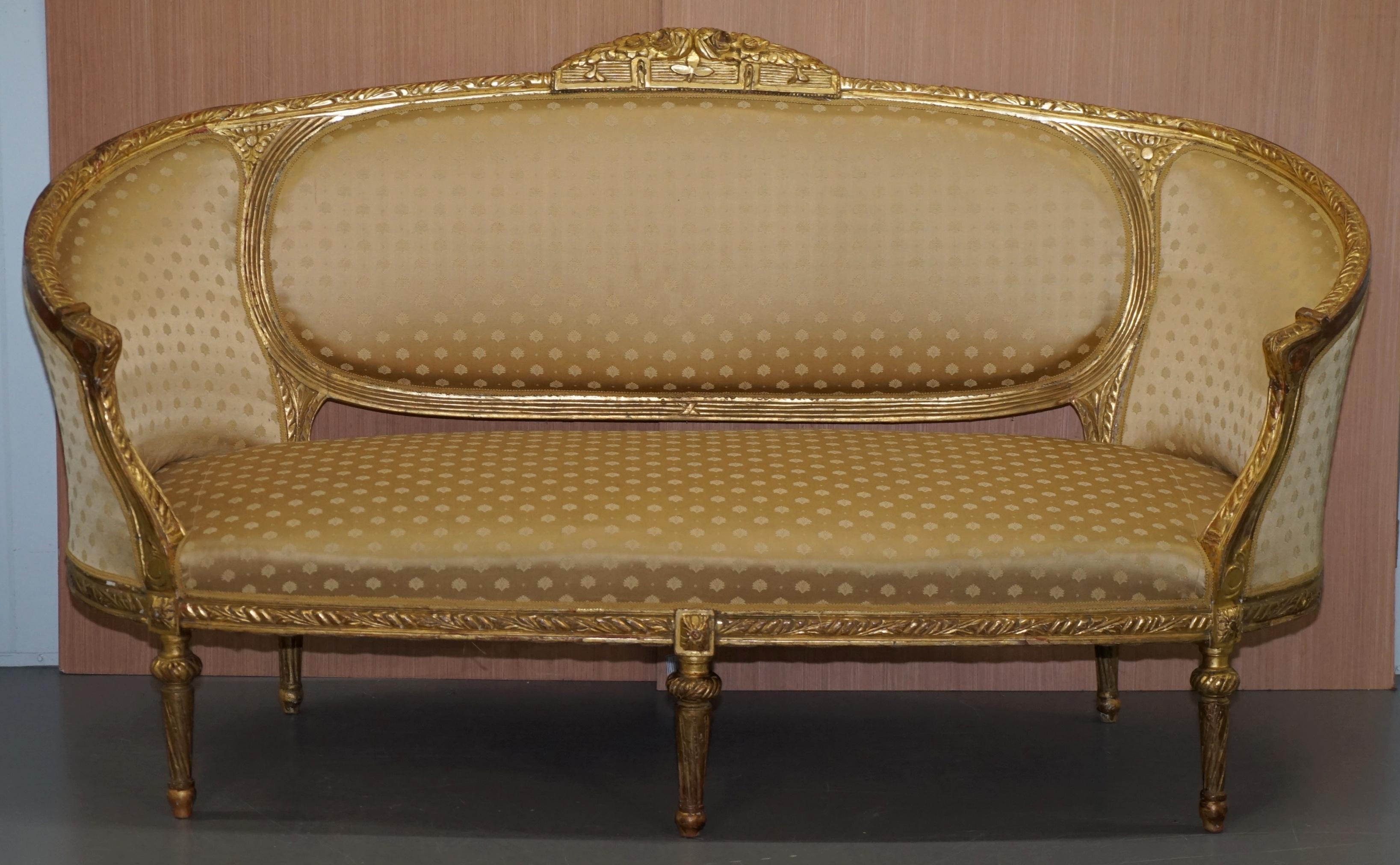We are delighted to offer for sale this original Napoleon III giltwood circa 1870 Salon sofa which is part of a suite

This set includes two matching armchairs, one is in perfect condition, the other needs a repair, both of which are listed under