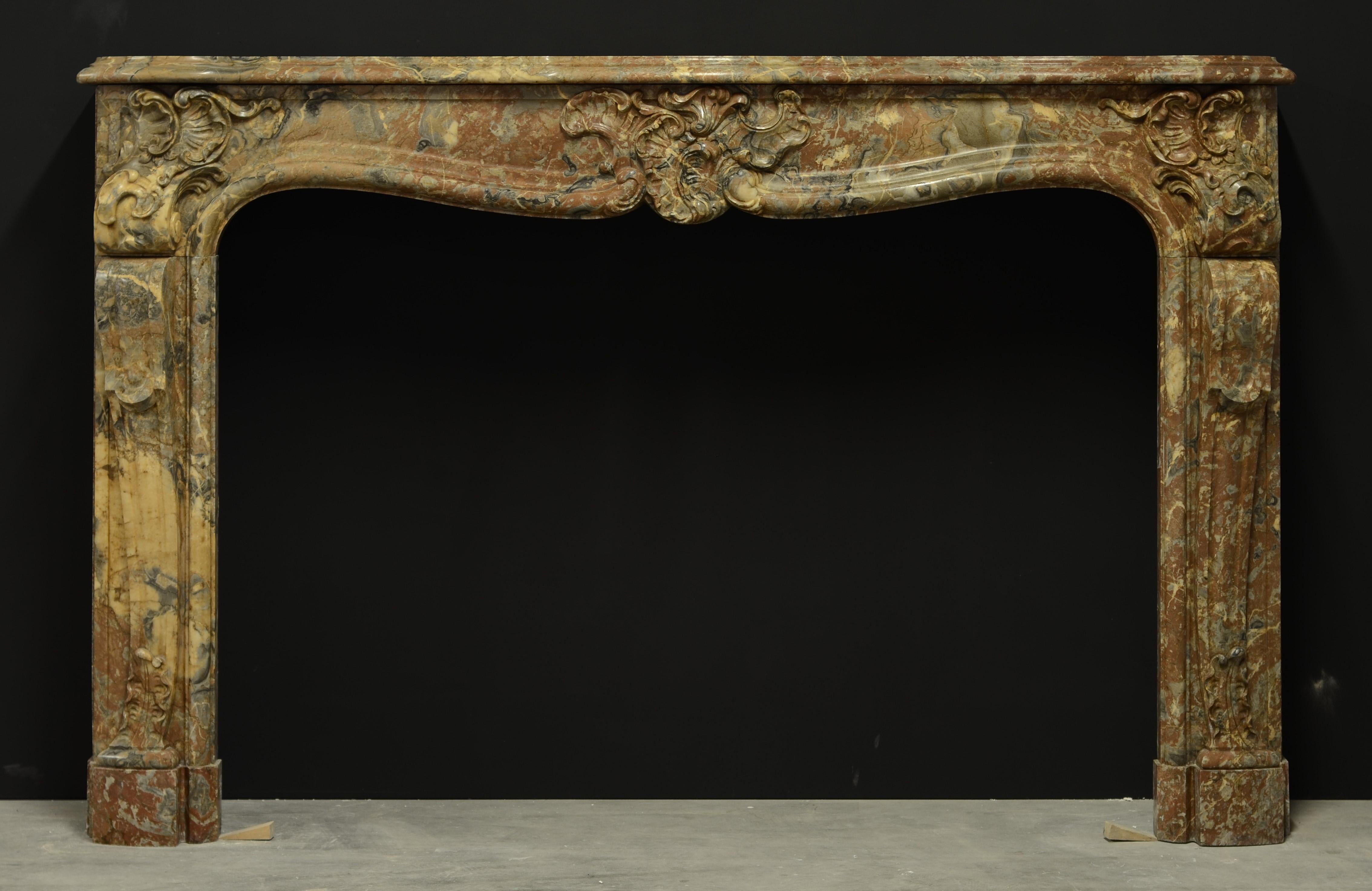 Stunning French marble Louis XV fireplace mantel.

This late 18th century Louis XV French mantel is executed in beautiful 