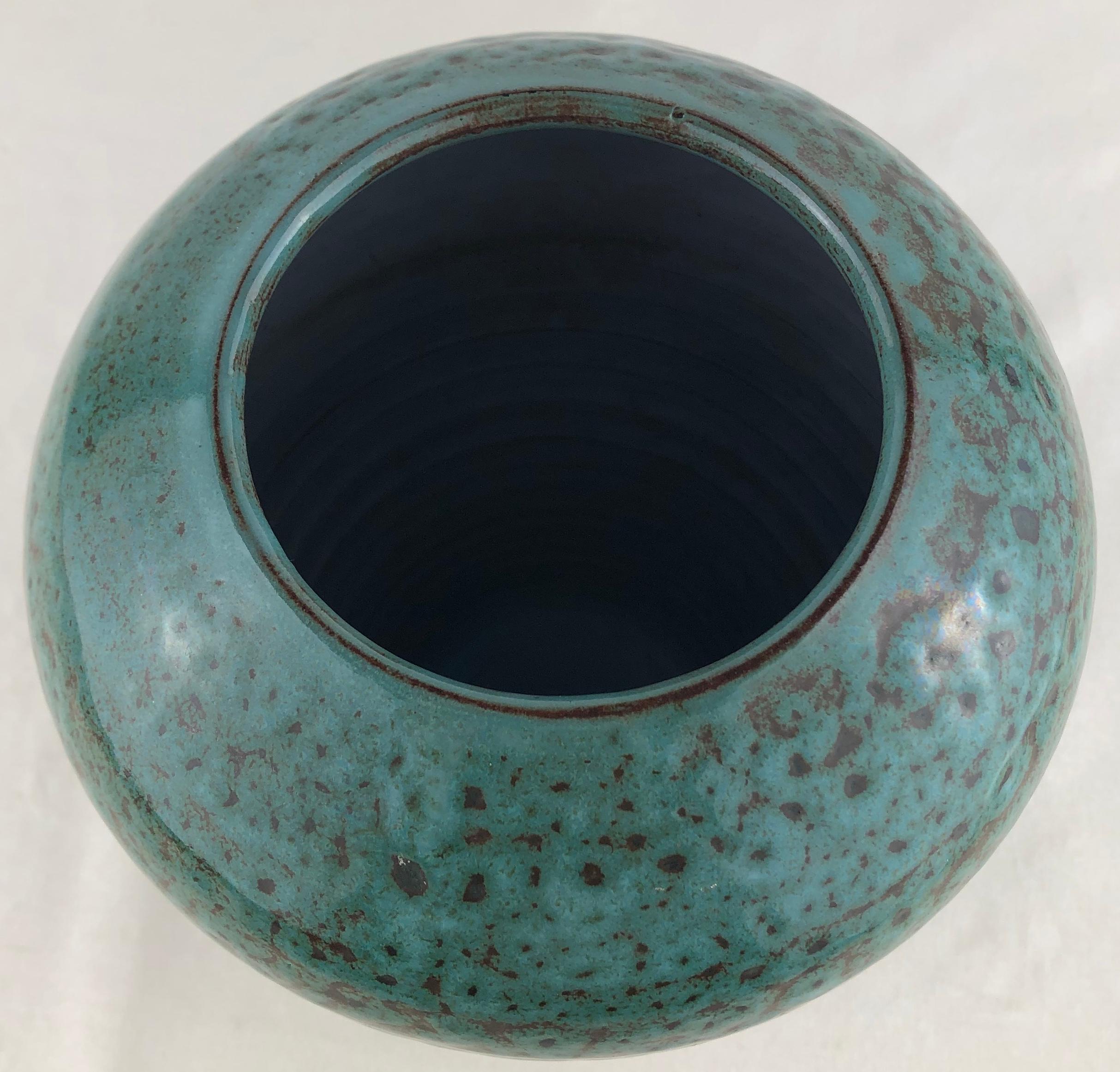 Midcentury French ceramic vase in a stunning turquoise color. 
Handcrafted and beautifully glazed. This is a signed piece, however, we have not been able to identify the name of the ceramic artist. Made in the style of Accolay ceramics, Accolay was