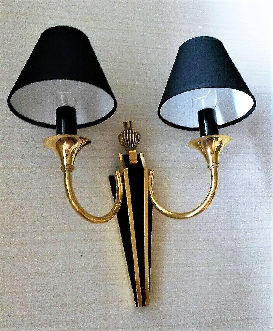 Gorgeous pair of two-arm sconces by Maison Jansen, France, 1950s
neoclassical style, in bronze with a black patina and new black cotton lampshades.
In a very good general condition, new wires and suitable for US standards (maxi 40 watts per