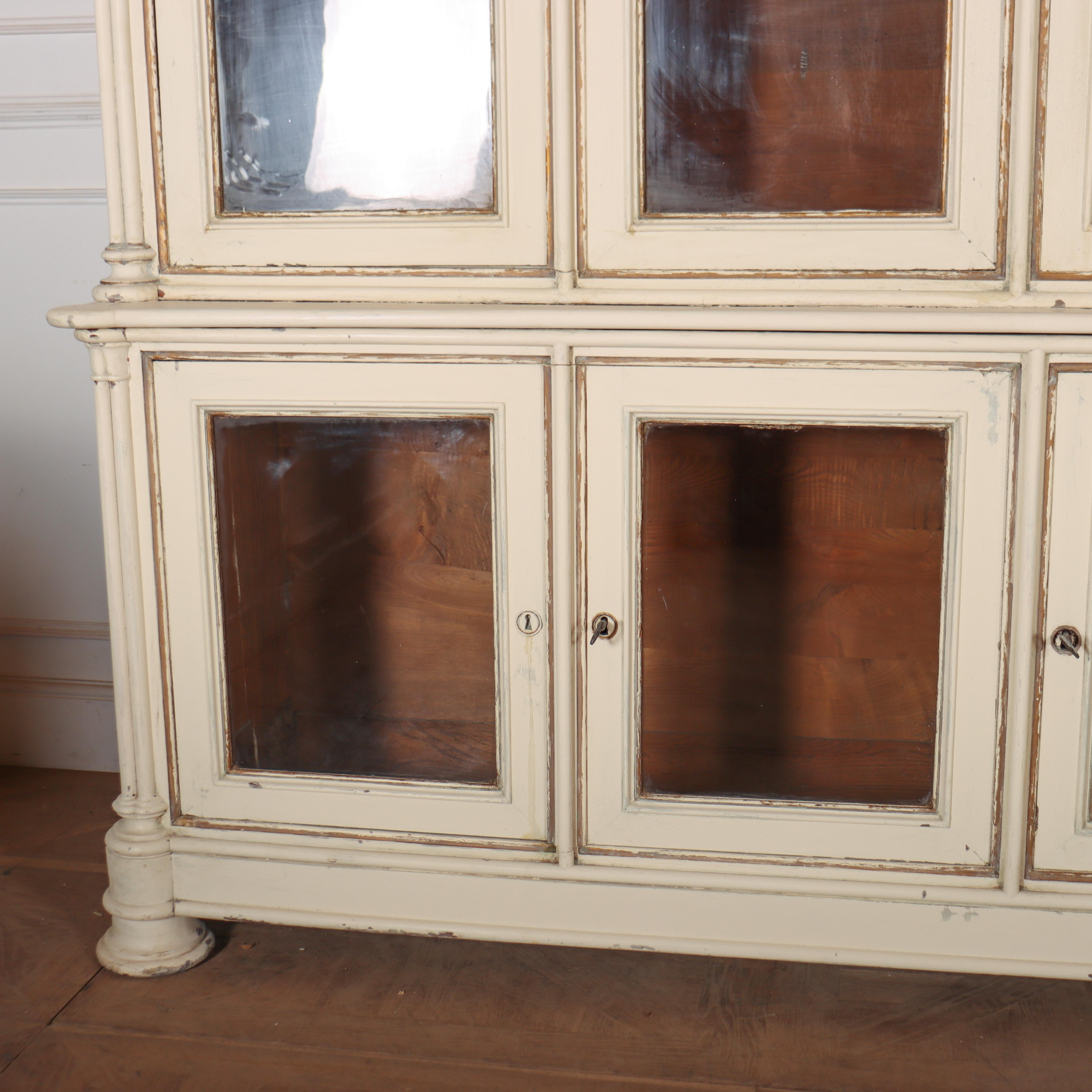Stunning early 19th century French bookcase from a large chateau / castle in Brittany. The piece has a lovely original paint finish with an oak interior. The top of the bookcase dismantles for ease of transport. 1820.

Code: 8652

Dimensions:
W: