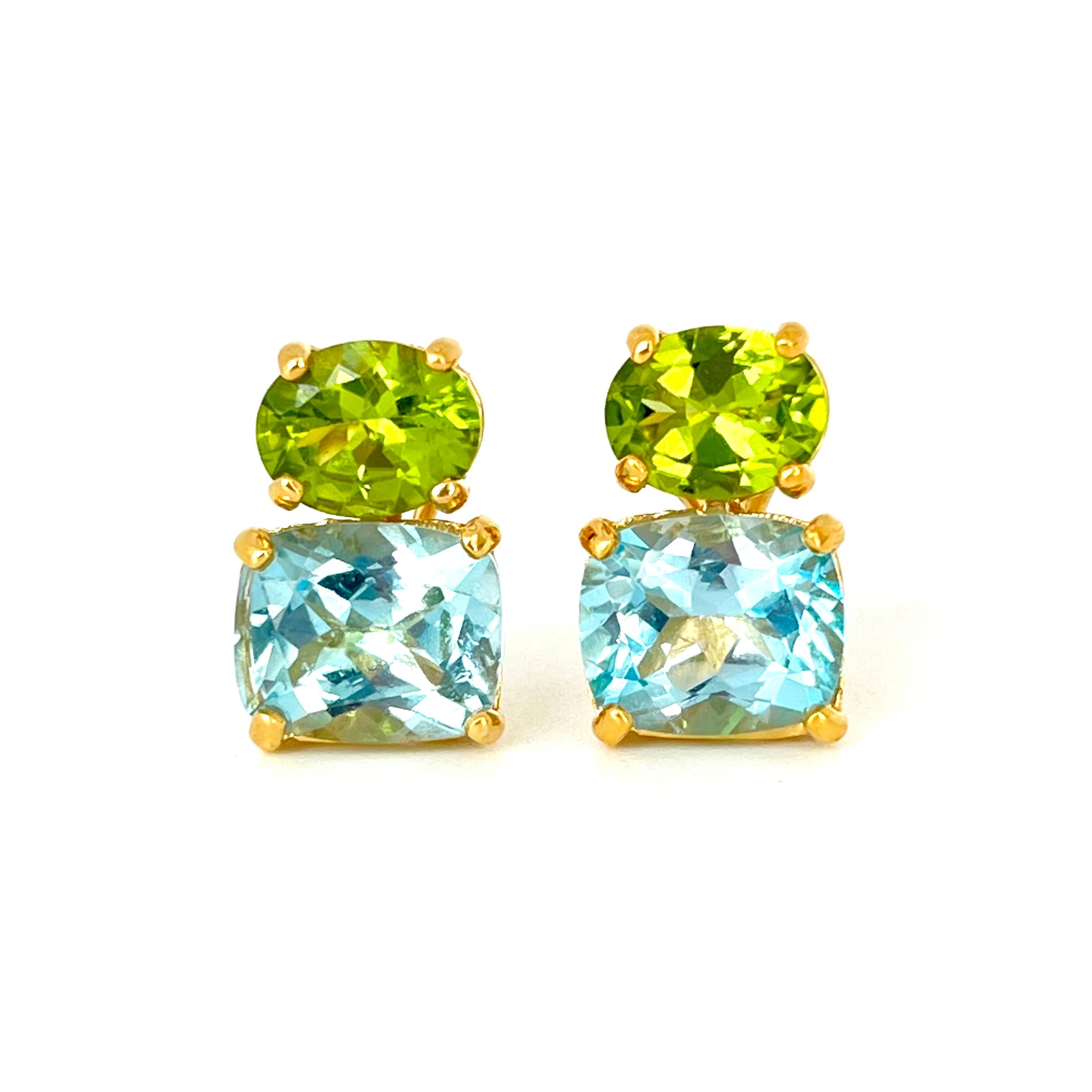 These stunning pair of earrings features a pair of genuine oval green peridot with cushion-cut sky blue topaz, handset in 18k yellow gold vermeil over sterling silver. The green and blue combination just look so great together! Straight post with