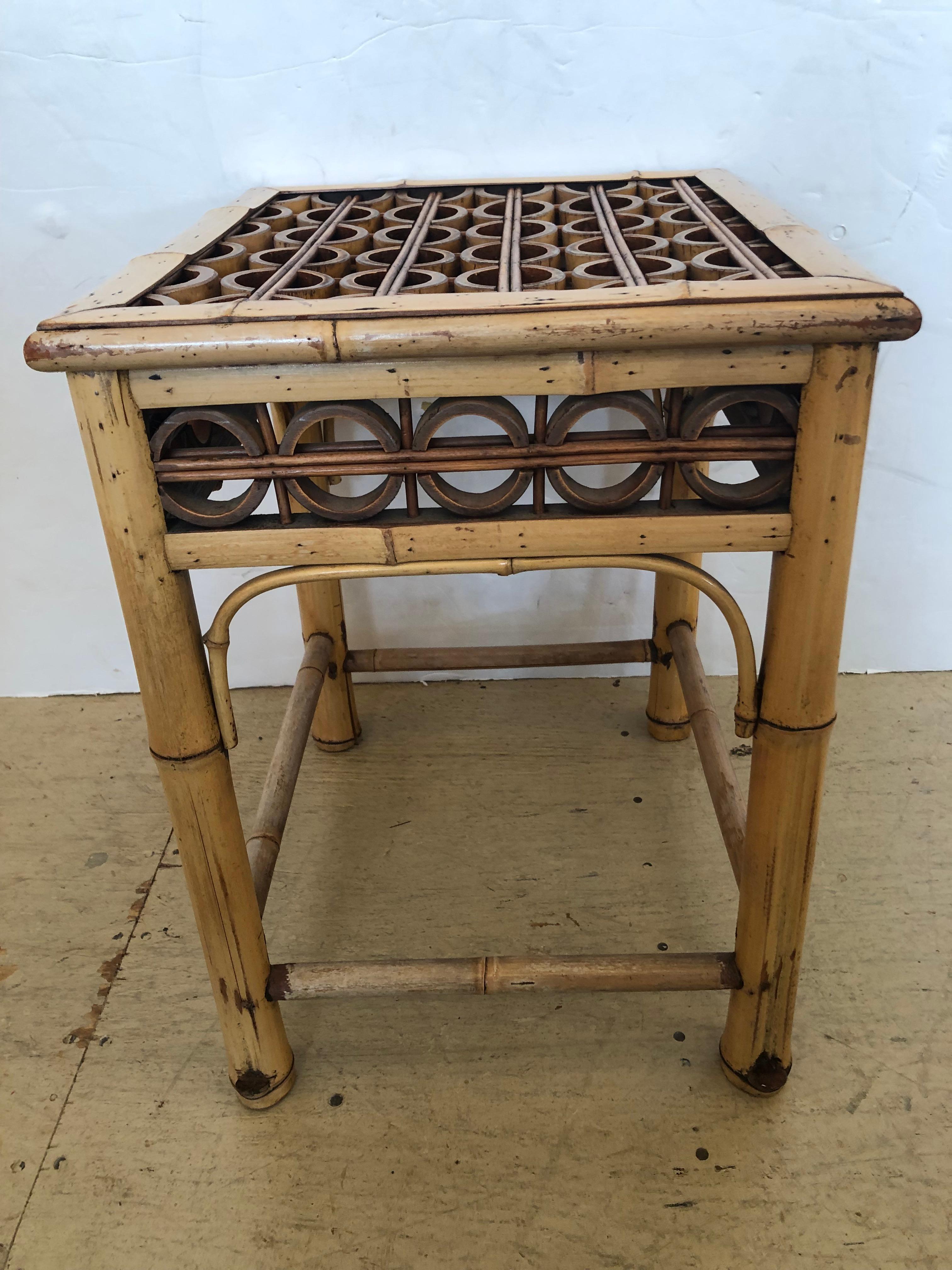 Great looking and perfectly sized bleached bamboo end table having geometric handiwork on top.