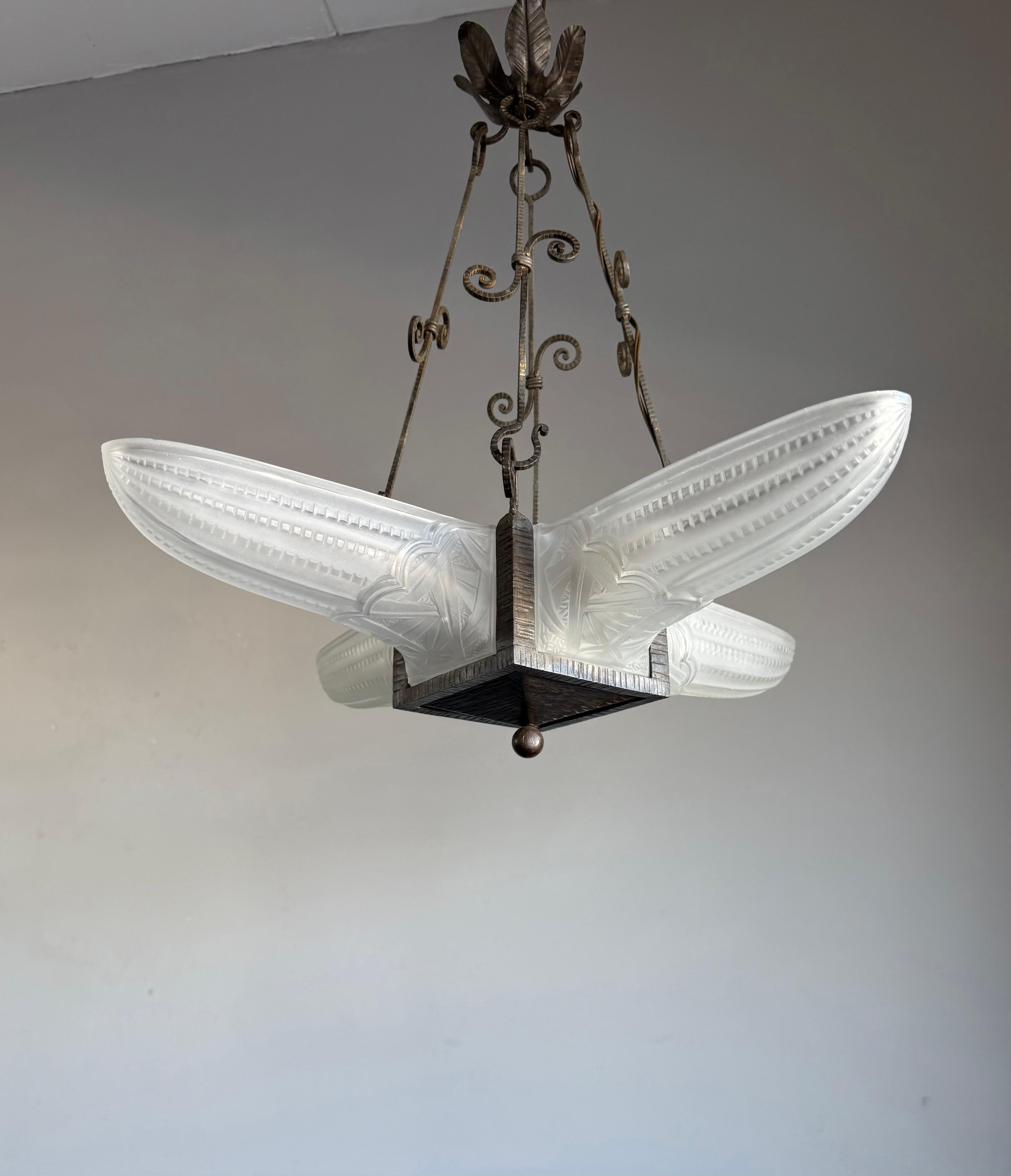 A bargain for the collectors of top quality Art Deco pendants.

This 20th century, practical size chandelier is not marked, but judging from the design and materials it must be by one of France's finest when it comes to Art Deco light fixtures. The