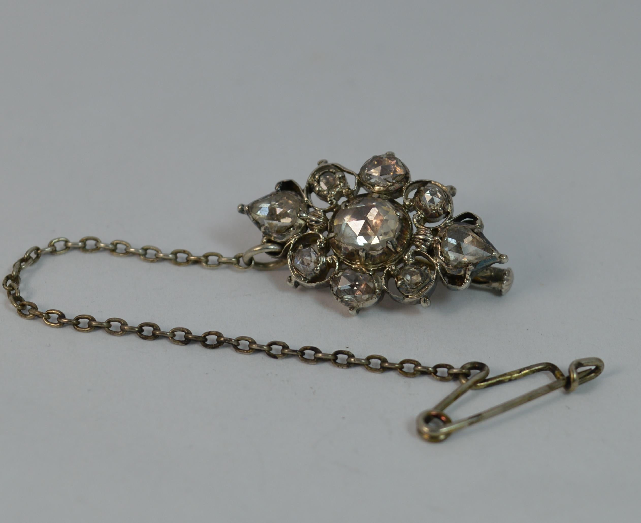A rare true Georgian period pendant or brooch circa 1770.

Solid 15 carat rose gold example set with silver head setting, typical of the period.

Designed with many natural rose cut diamonds, all original, clean and sparkly. Total spread is the